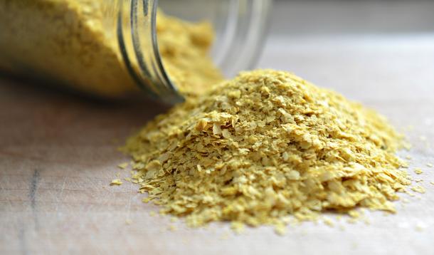 I've used a sprinkling Bob's Red Mill Nutritional Yeast to give my garlic bread a hint of cheesiness without any added dairy. Image source Yummy Mummy Club .