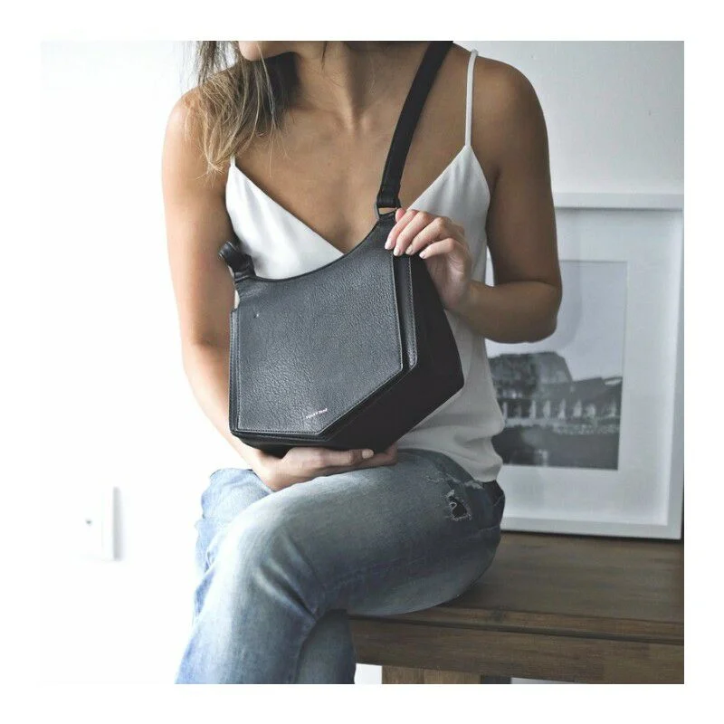 The Pailey Crossbody in Black by Pixie Mood is a stylish cross body bag, made with vegan leather. Photograph by Pixie Mood. 