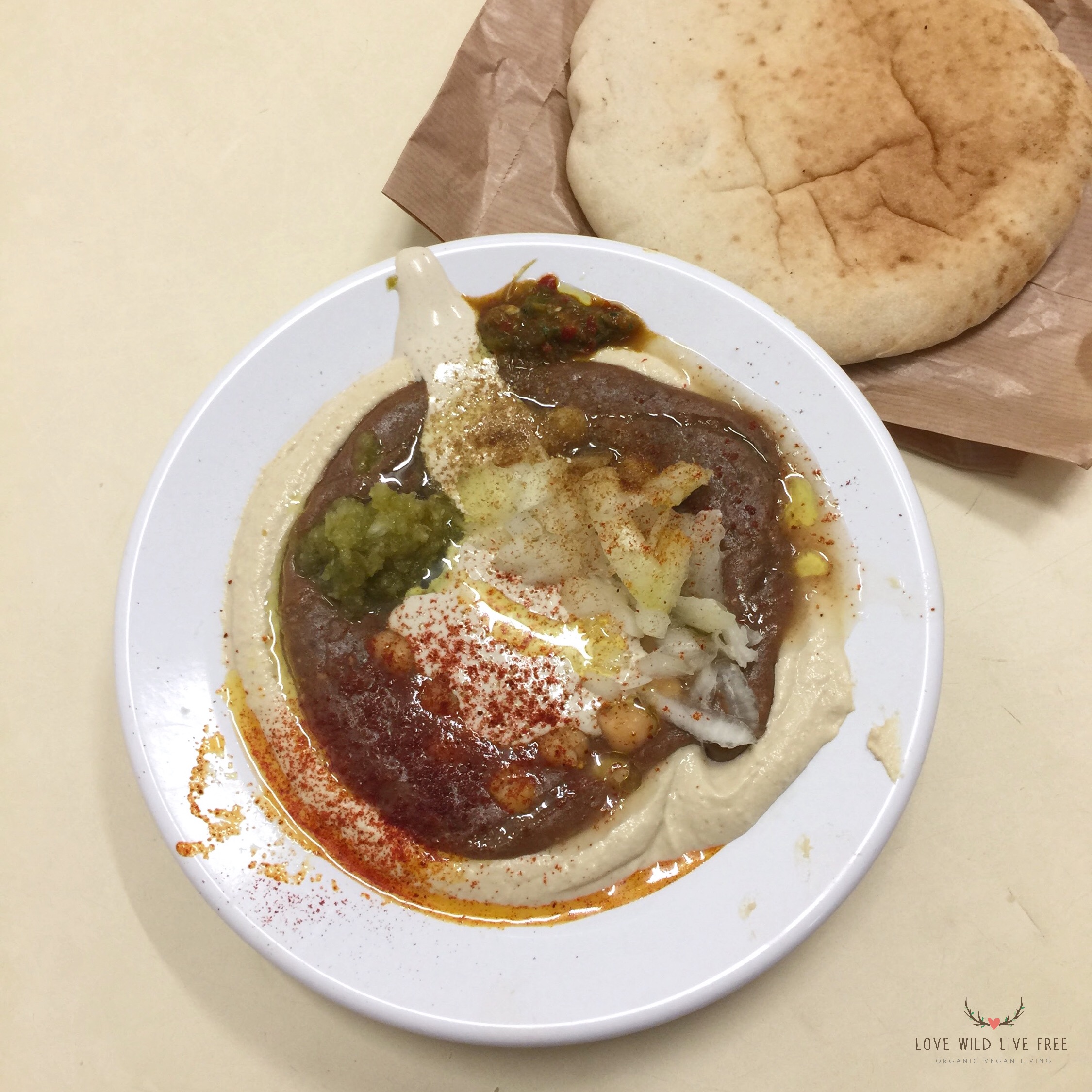 When you visit the Carmel Market, definitely stop at Hummus HaCarmel for some of the best hummus, which is also said to be the cheapest in Tel Aviv. Photo by: Love Wild Live Free.
