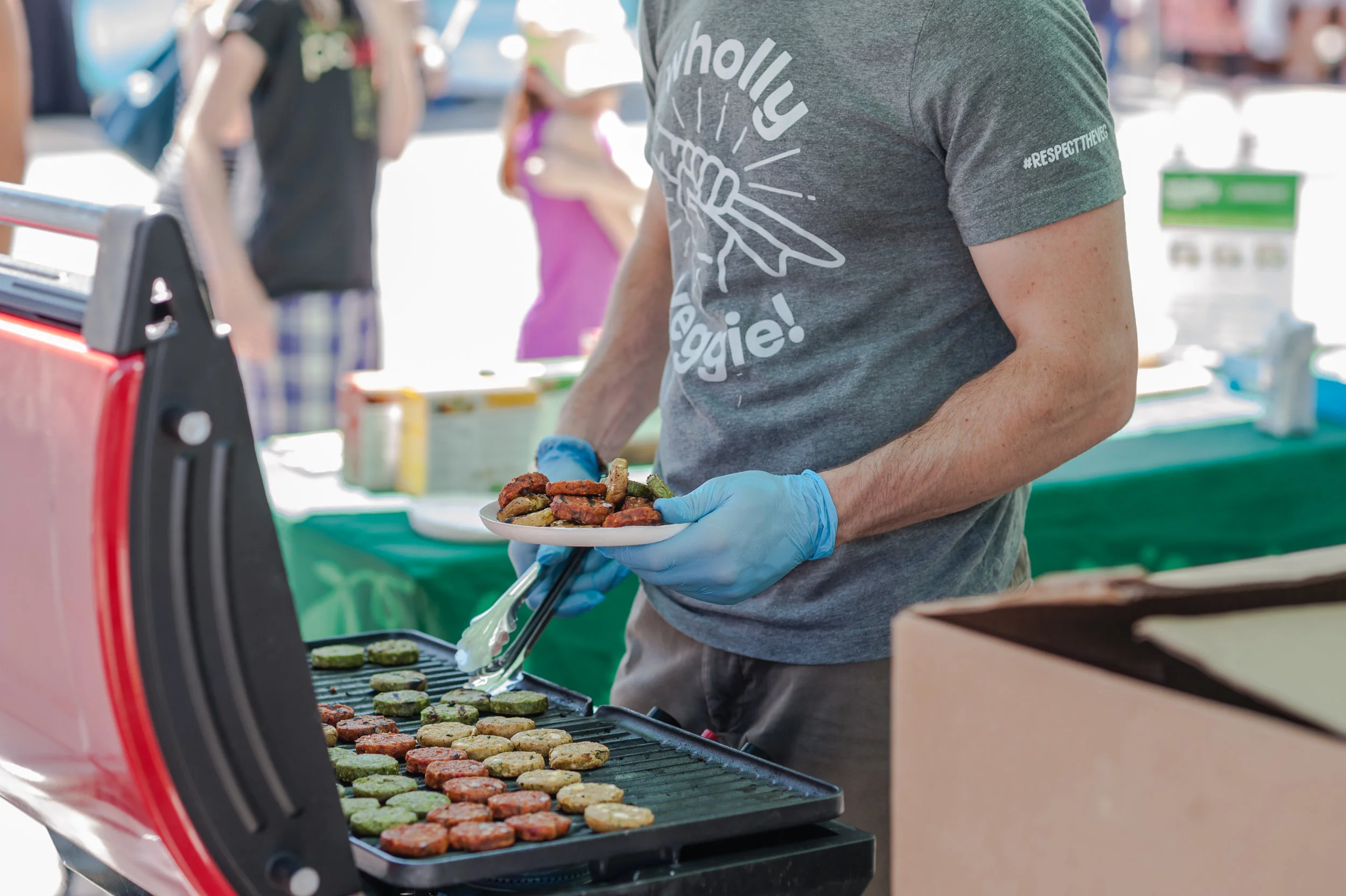 There was no shortage of vegan eats, including complimentary tasting items! Wholly Veggie sampled a variety of veggie burgers for guests to enjoy. Photo by: LOF Photography .
