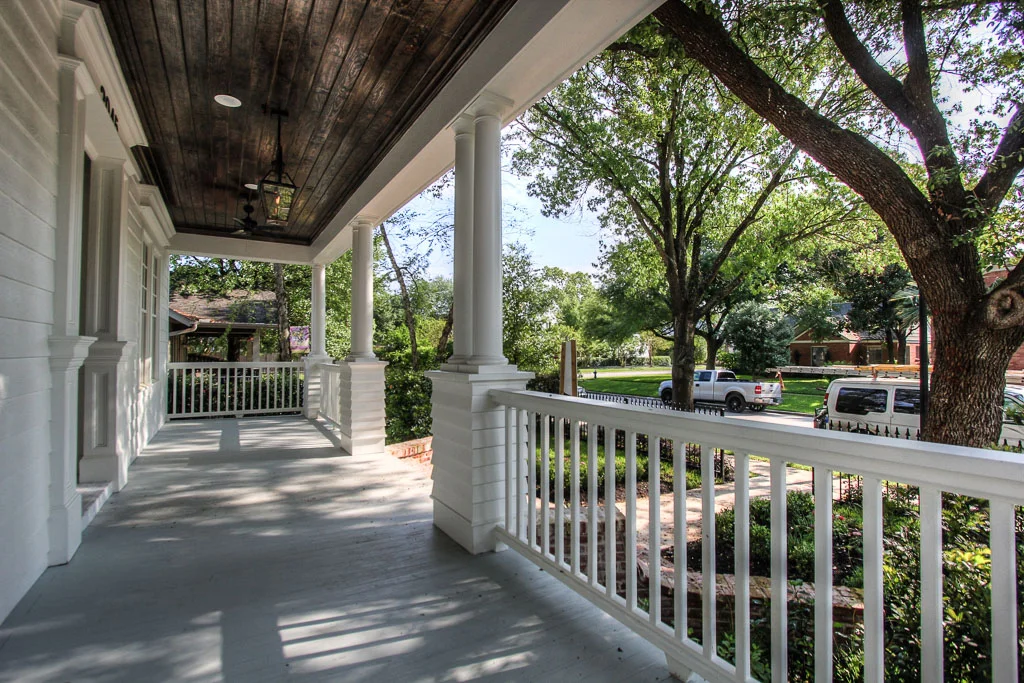 A deep front porch frames the inviting front entrance and is a welcoming area to sit and enjoy the peacefulness and sense of community that the Houston Heights is so well known for.