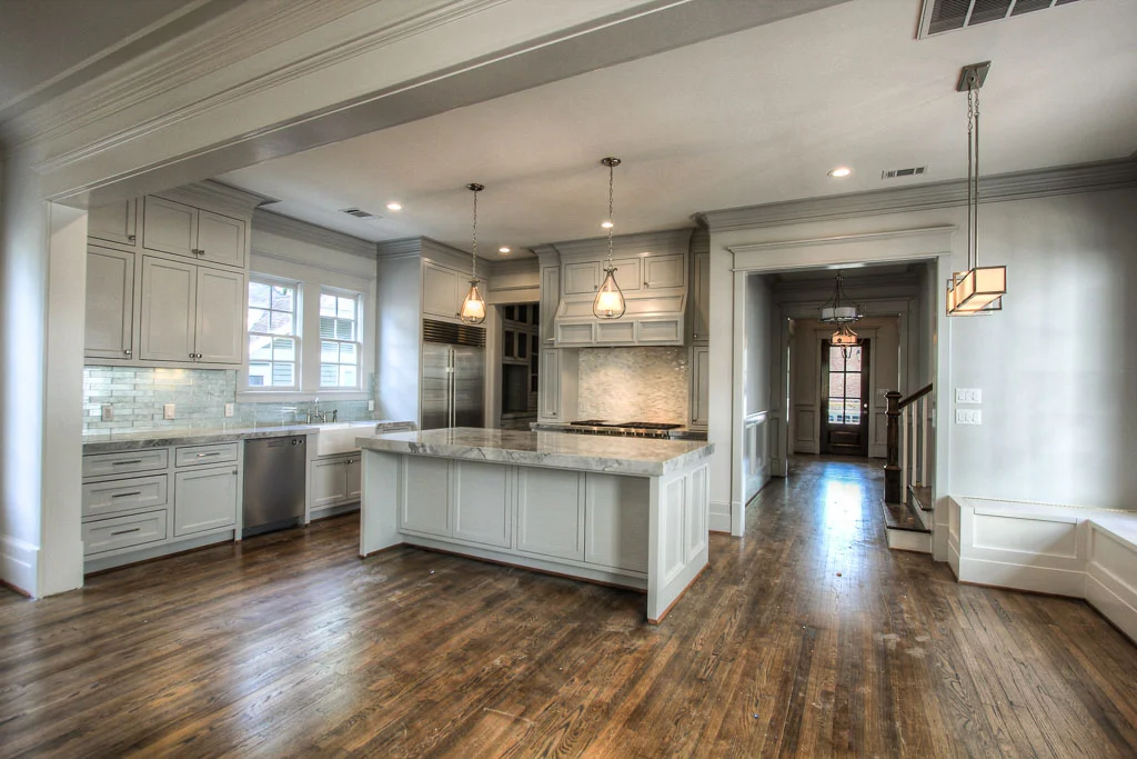 Site-built cabinetry and professional-grade Wolf Performance appliances maximize functionality of the kitchen, but the quartzite counters and Walker Zanger tile give it a distinct sense of style.