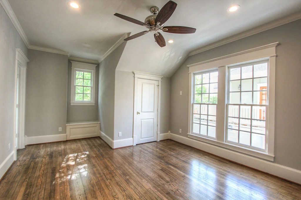 The upstairs bedrooms all have built-ins in the closets. This bedroom also has additional storage concealed in a window seat. These are the builder's signature touches.