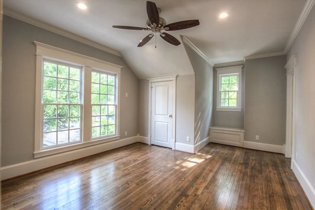 The upstairs bedrooms all have built-ins in the closets. This bedroom also has additional storage concealed in a window seat. These are the builder's signature touches.
