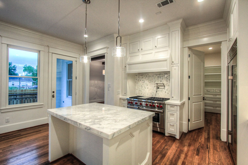 The kitchen and great room are flooded with natural light from the wide open green area that will always neighbor Allston.