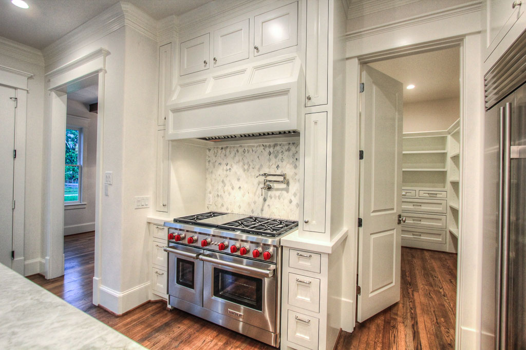 Wolf Performance appliances, including a 48" Sub Zero refrigerator. The marble tile in the backsplash has cool understated tones that will have a lasting appeal.