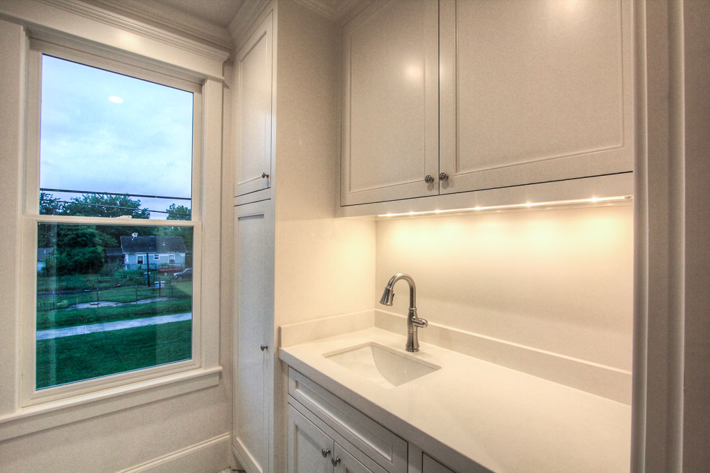 The utility room also has marble counters and an operable window.