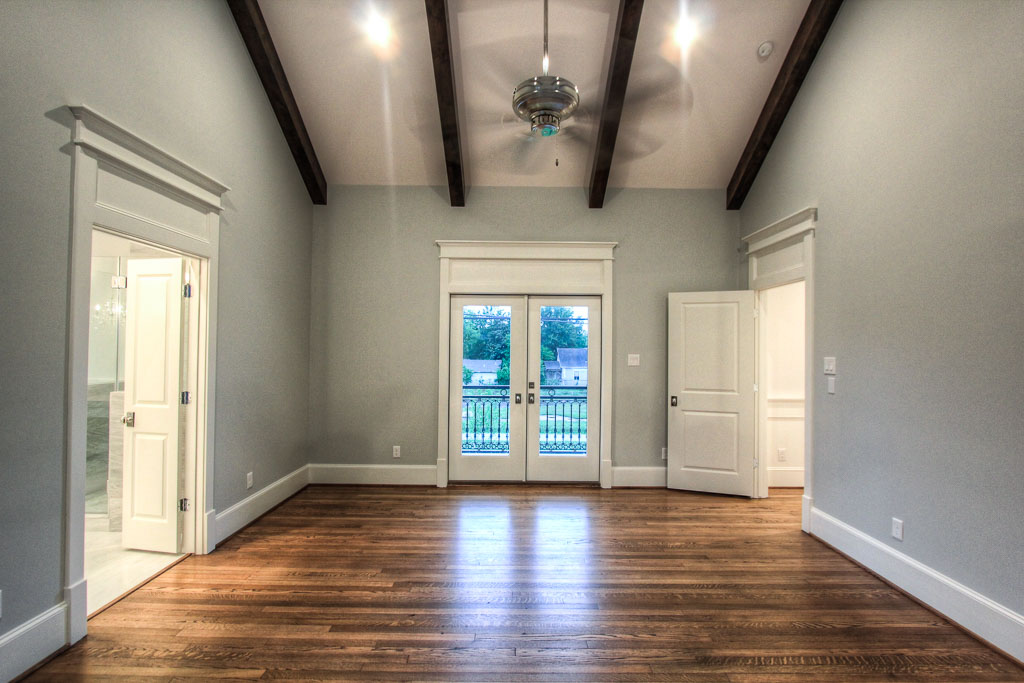 The oversized master has a private balcony once again overlooking the hike & bike trail, but with a unique, serene ambience with stained ceiling beams and cool, grey tones.