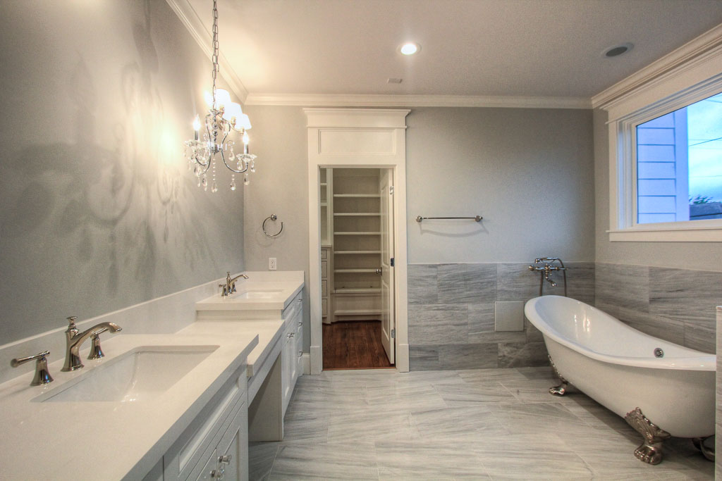 The huge master bathroom has marble floors and surrounds, with highly customized marble tile selections in the shower.