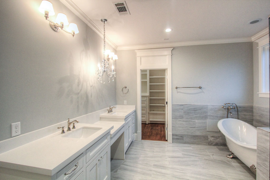 The huge master bathroom has marble floors and surrounds, with highly customized marble tile selections in the shower.