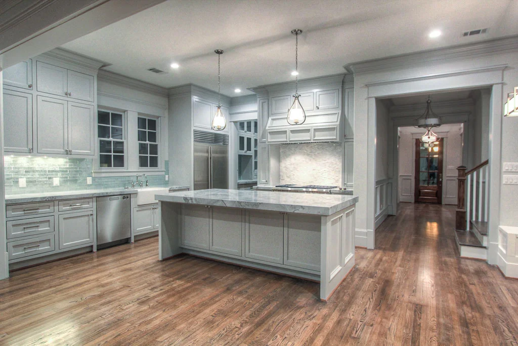 Site-built cabinetry and professional-grade Wolf Performance appliances maximize functionality of the kitchen, but the quartzite counters and Walker Zanger tile give it a distinct sense of style.
