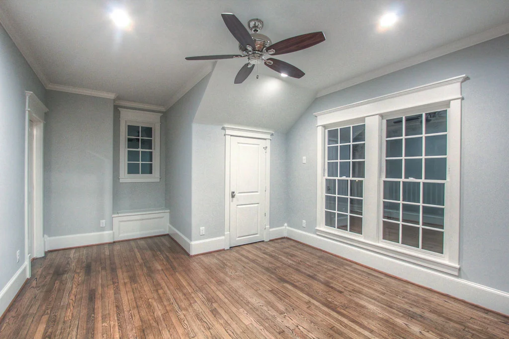 The upstairs bedrooms all have built-ins in the closets. This bedroom also has additional storage concealed in a window seat. These are the builder's signature touches.