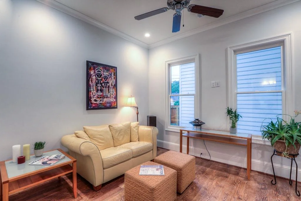 Windows in bedroom/study oversee backyard deck.
