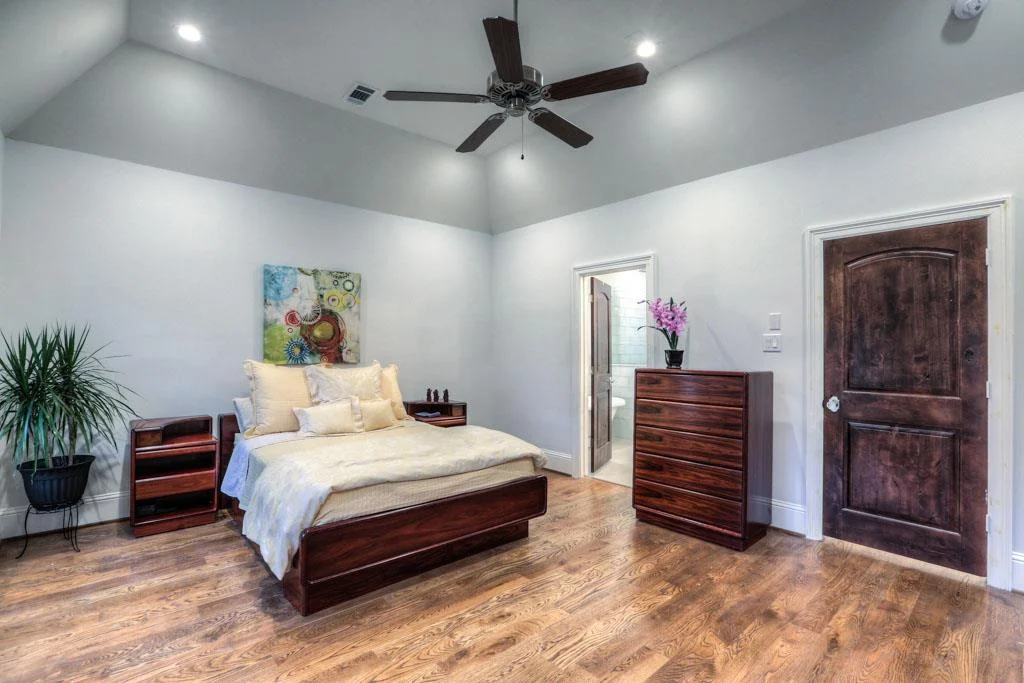 Another view of master bedroom. Master bathroom on left side of wall, closet to the right.