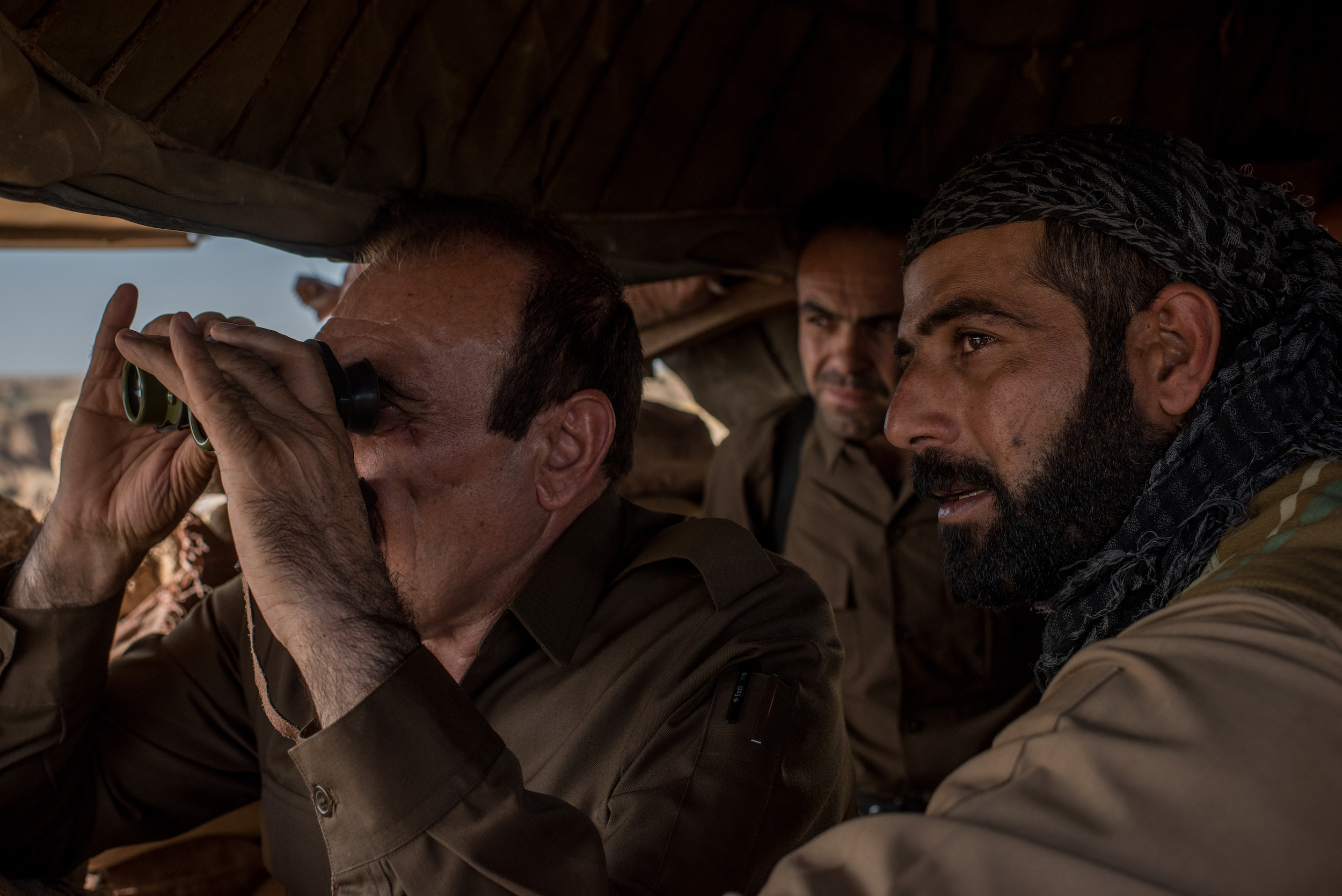 Ako has been a fighter since he was young and joined the Kurdish Peshmerga when he was only 15. He has three ink dots near his right eye and the phrase "life is torture" tattooed on his arm. An ambush left him wounded in 2014.