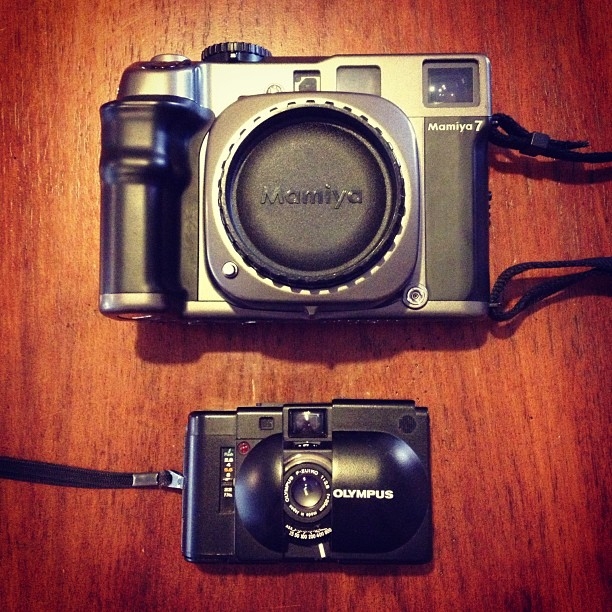The Mamiya-7, without lens, as compared to an Olympus XA 35mm rangefinder.