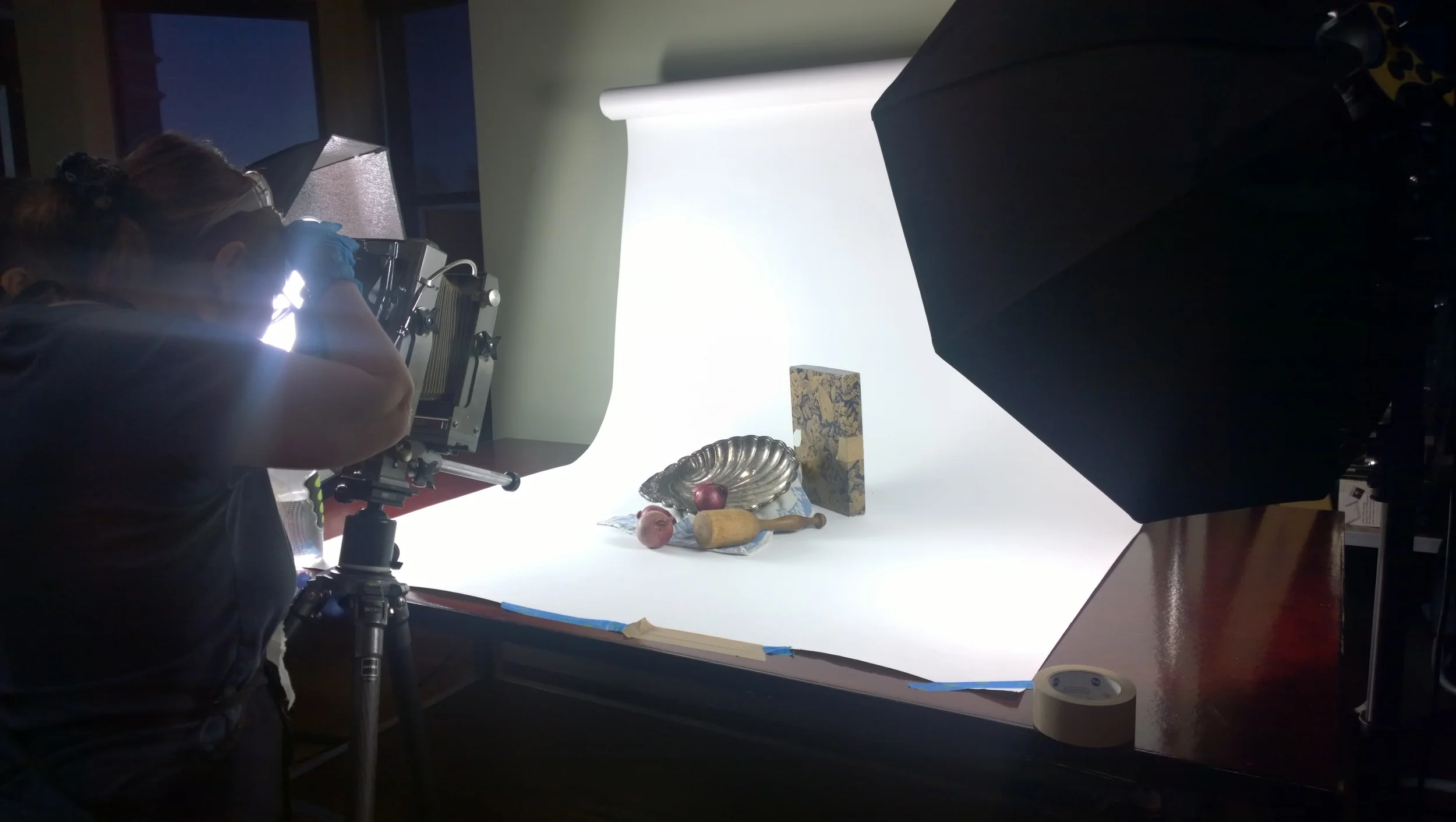 Large format cameras are focused through a ground glass screen.