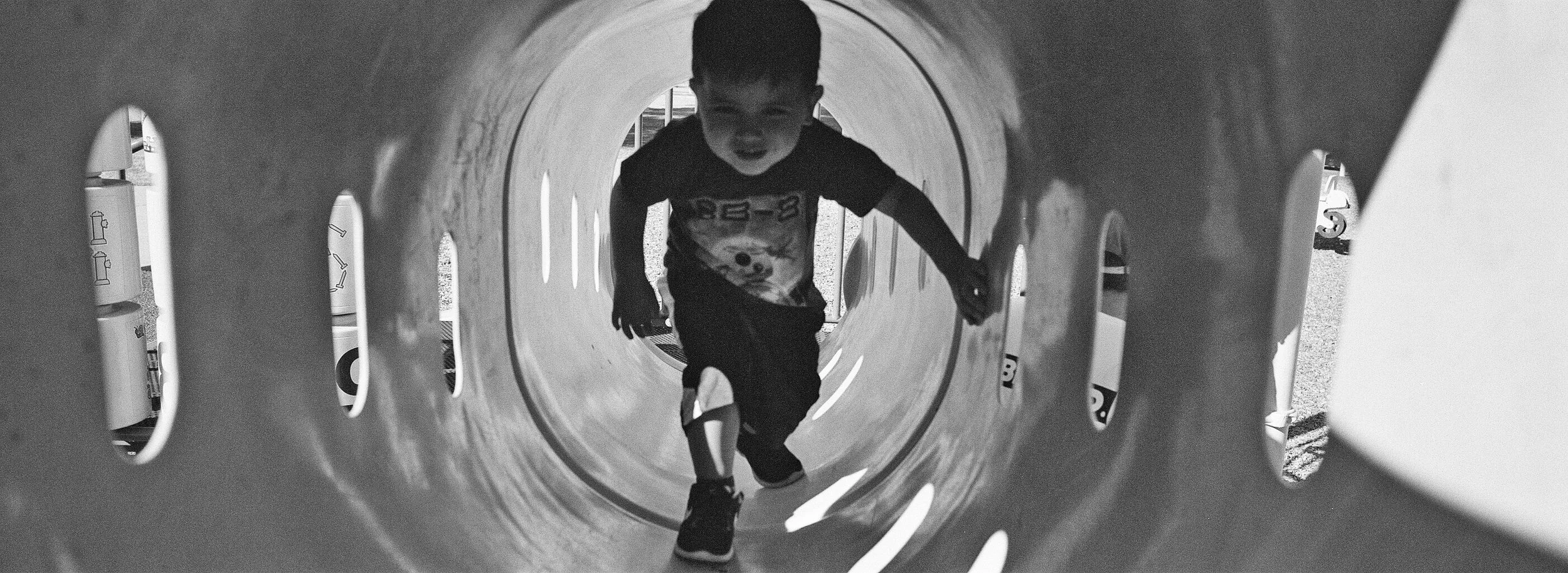 Alex in the playground; Ilford HP5