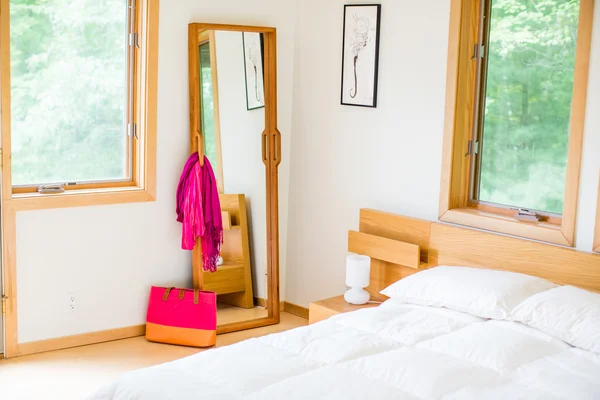 Full-length mirror in a solid hardwood frame. Can’t-miss handles are a conversation piece, a help in moving around your space, and a dressing aide.