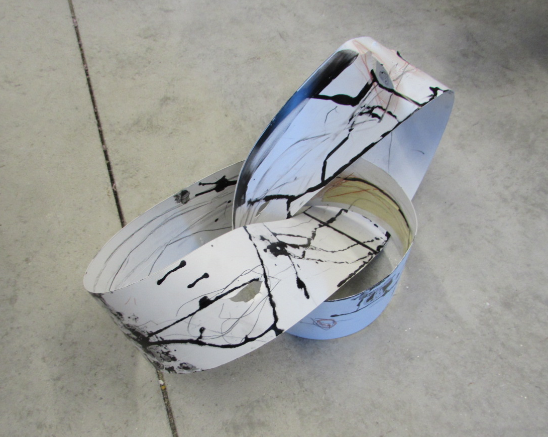 Nick Putnam wound this discareded strip of vinyl window blind into a moebius strip, and trickled rivulets of ink down it's varied inclines.