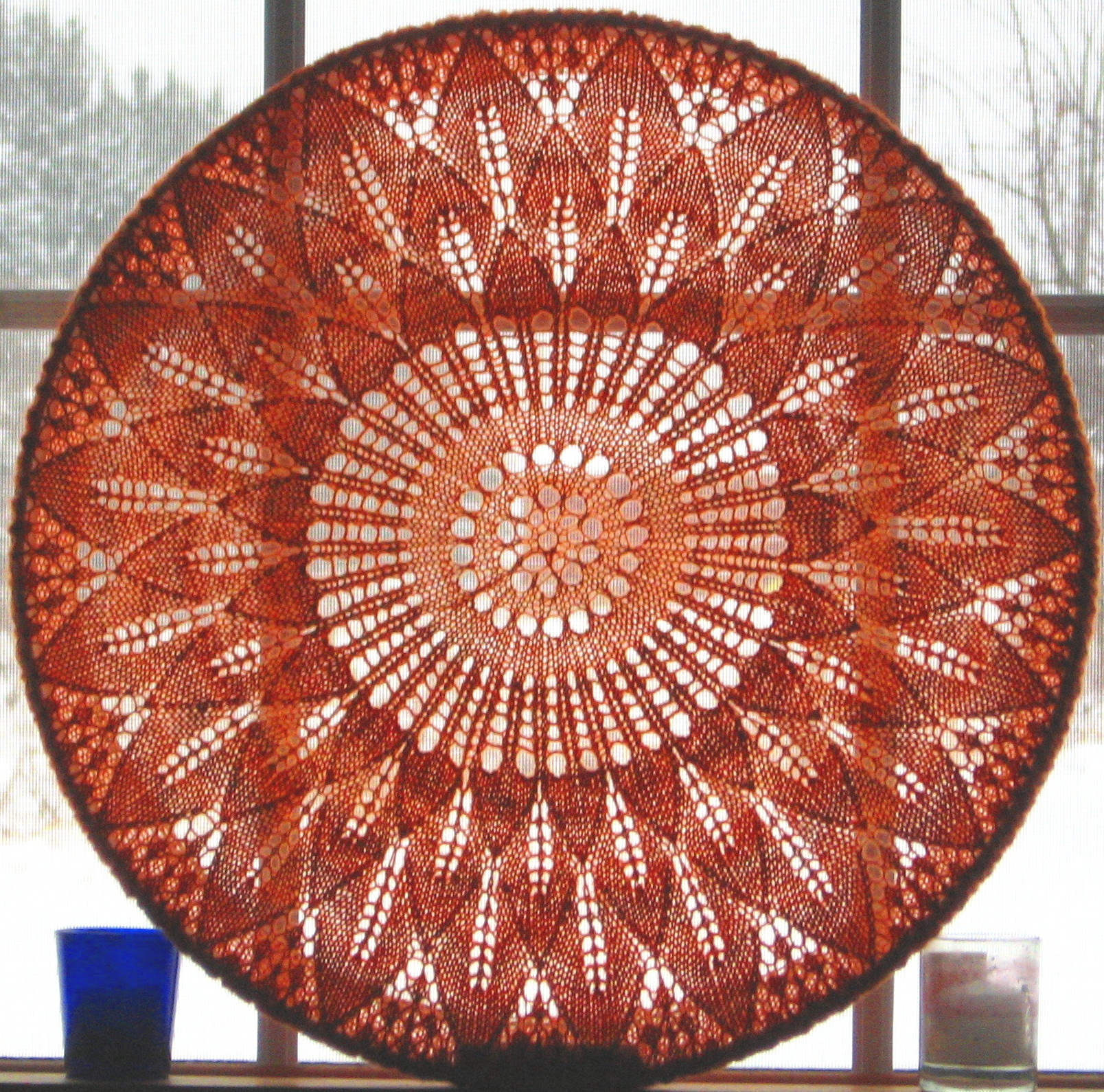 Adapted and modified from from the "Sun Ray" Dinner Cloth design by Marianne Kinzel, published in "The First Book of Modern Lace Knitting."
