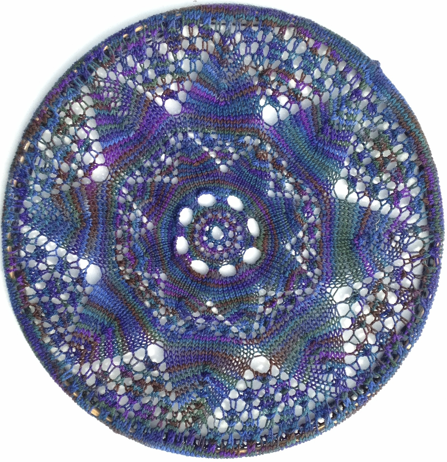 Adapted and modified from "Sunflower," an old pattern revived by Gloria Penning in her "Knitted Heirloom Lace III."