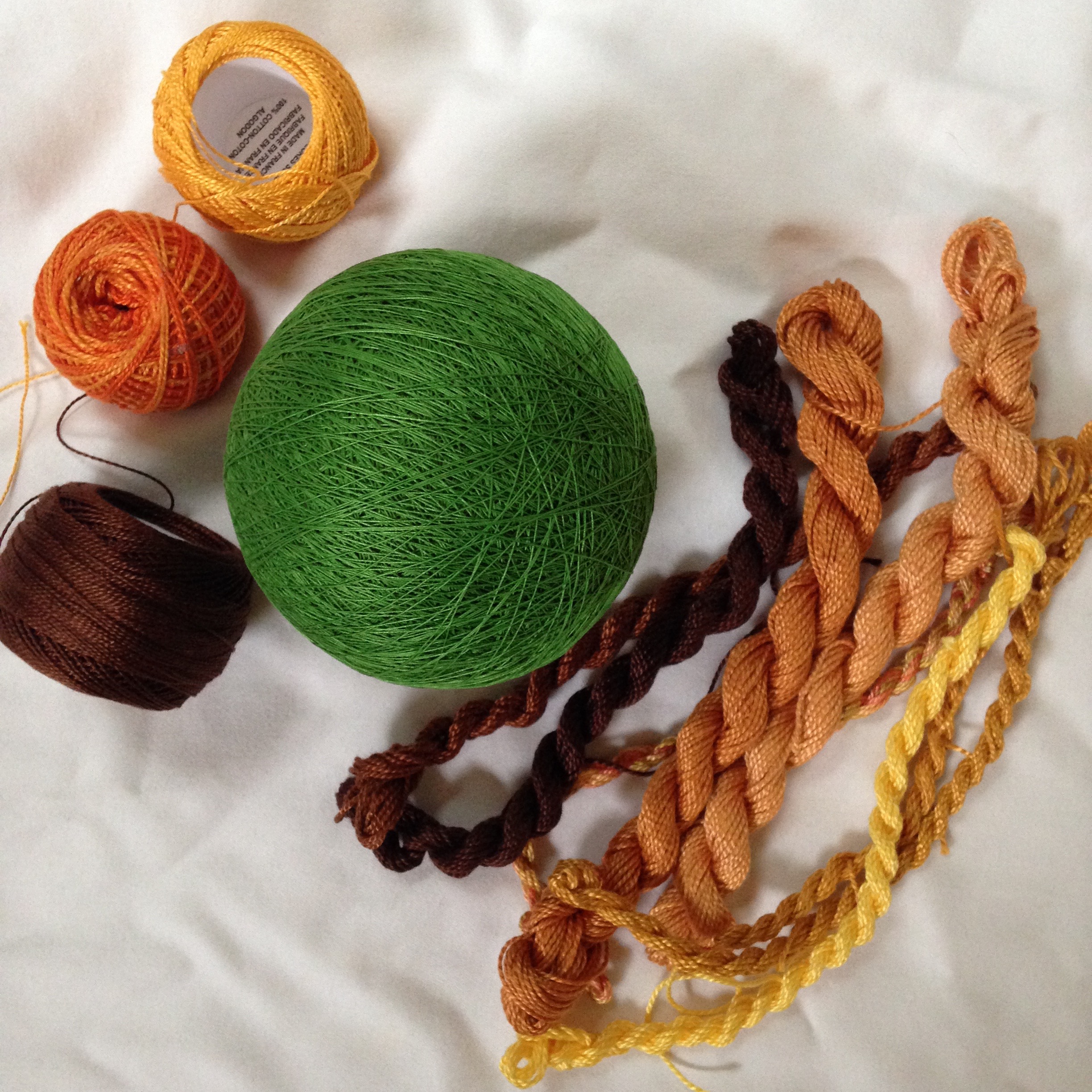 Still deciding between the finer #8 perle cotton on the left, or the slightly heavier #5 threads on the right.