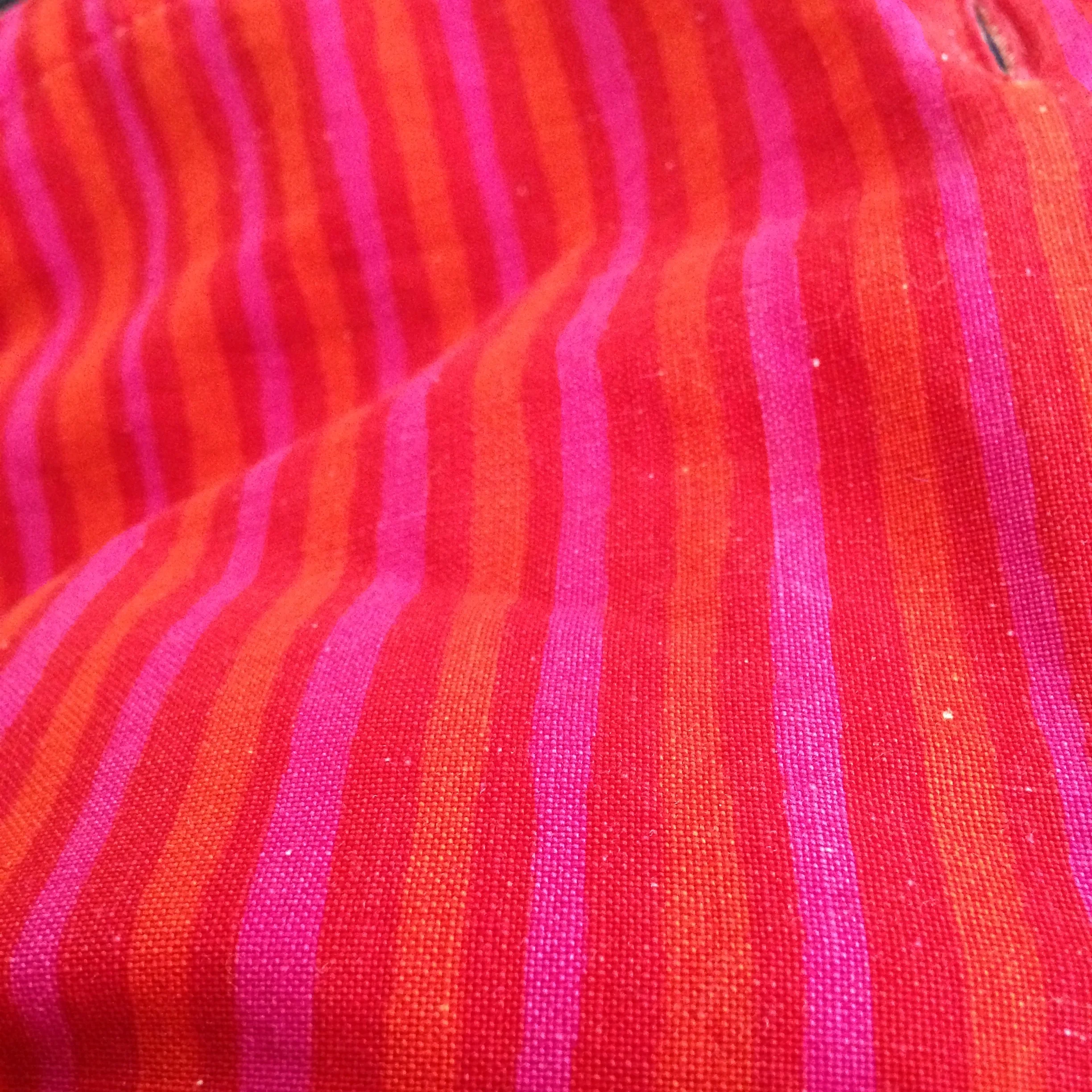 The original photo: closeup of my red/orange/hot pink striped Marimekko shirt.