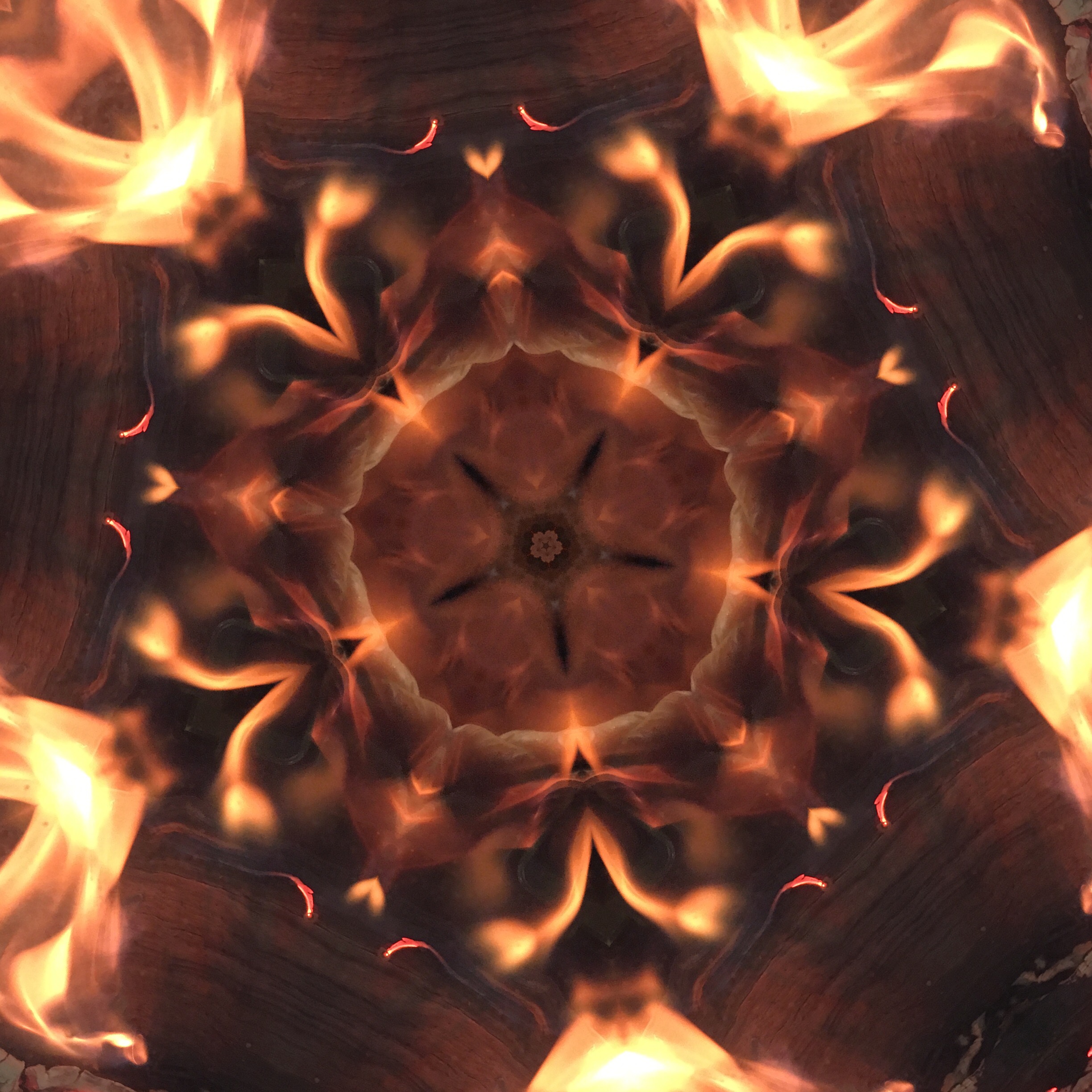 Fire in the woodstove, kaleidoscoped.