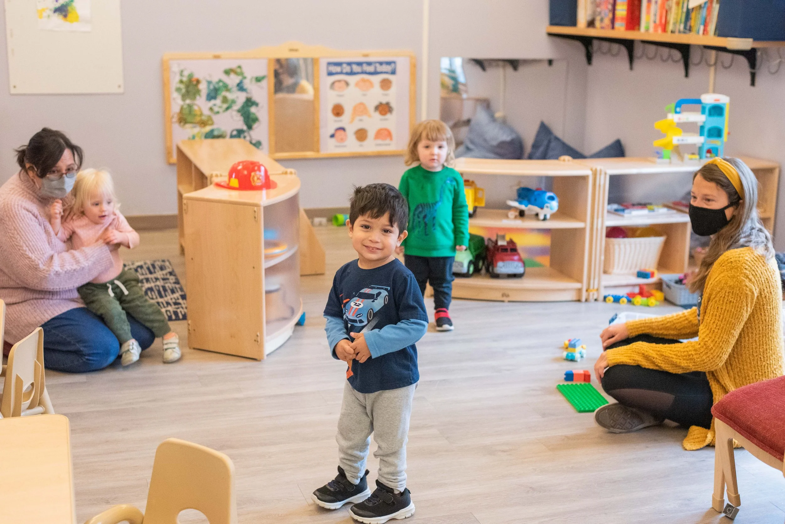 Christopher smiles in Dewdrops classroom.jpg