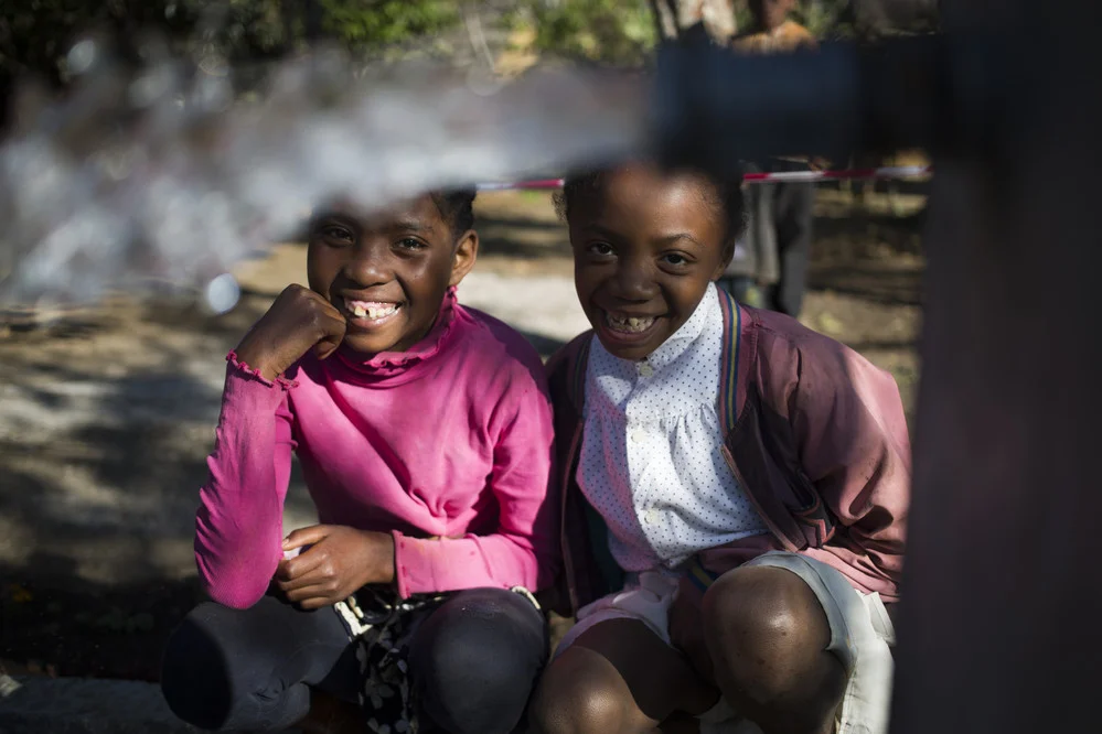 “This is amazing and from now on I no longer have to fetch water far away from home anymore.” Noeline with her friend Lalasoa. They will no longer have to endure the difficult task of collecting water every day from faraway sources.