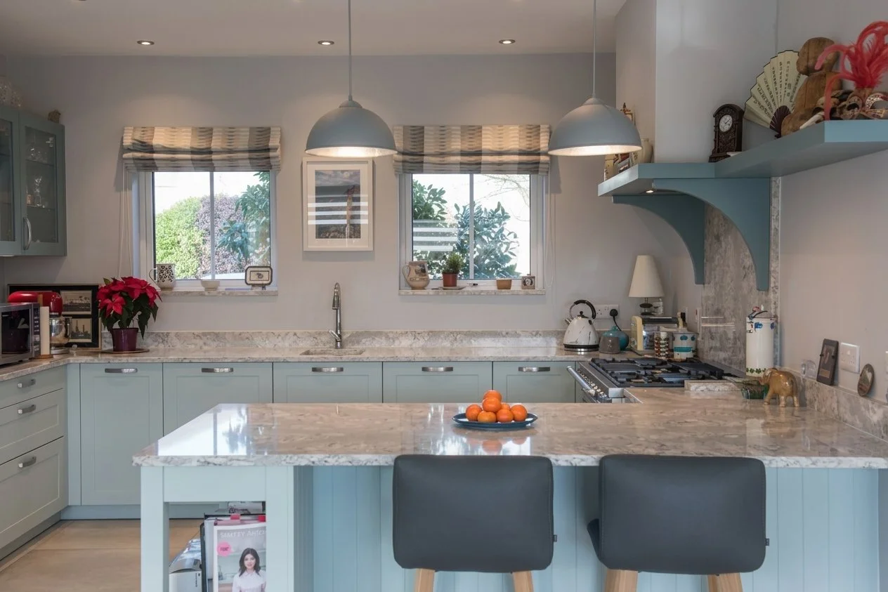 A contemporary shaker kitchen in a warm, family home.