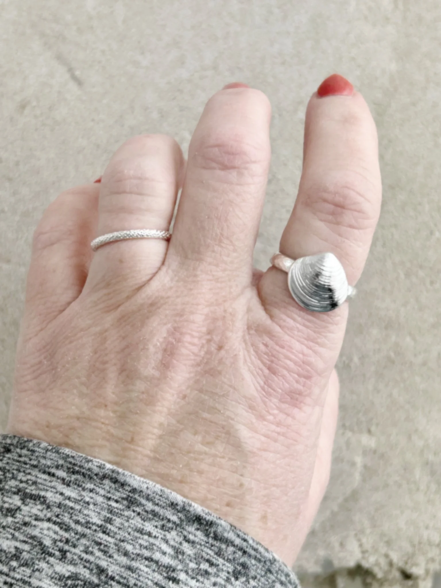 clam hammered band on finger.jpg