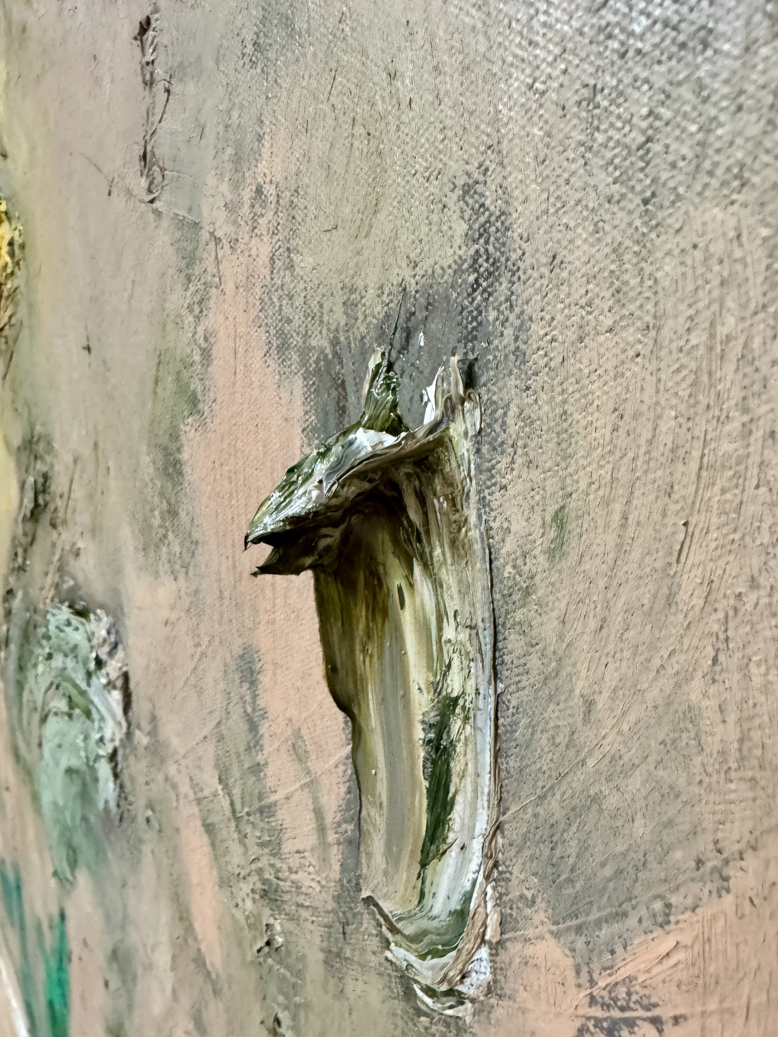 Minimalist oil painting close-up featuring a pale canvas with a single thick green stroke, highlighting sculptural paint texture.