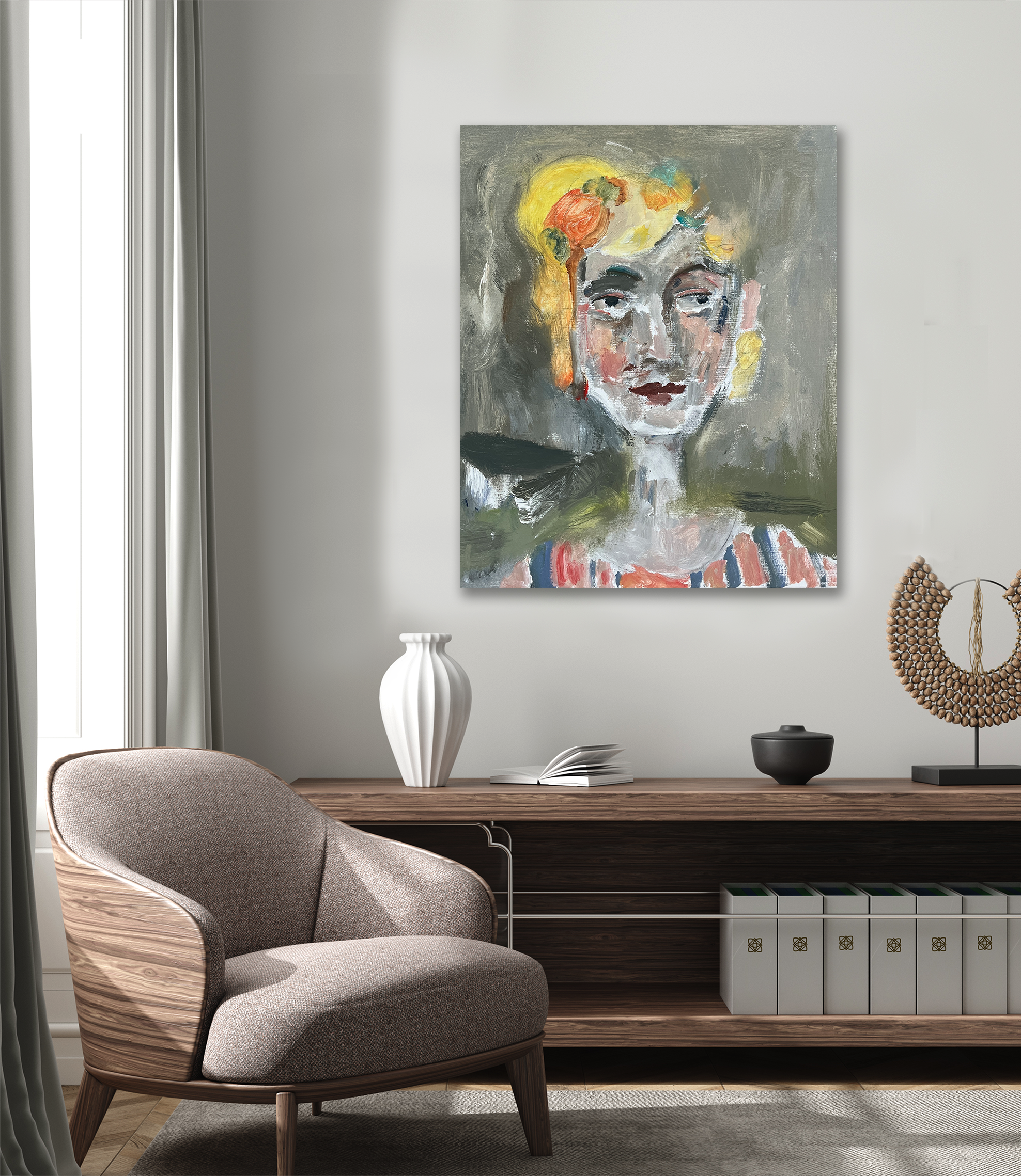 Modern living room with abstract face painting, sculptural decor, and gray armchair in a minimalist setting.