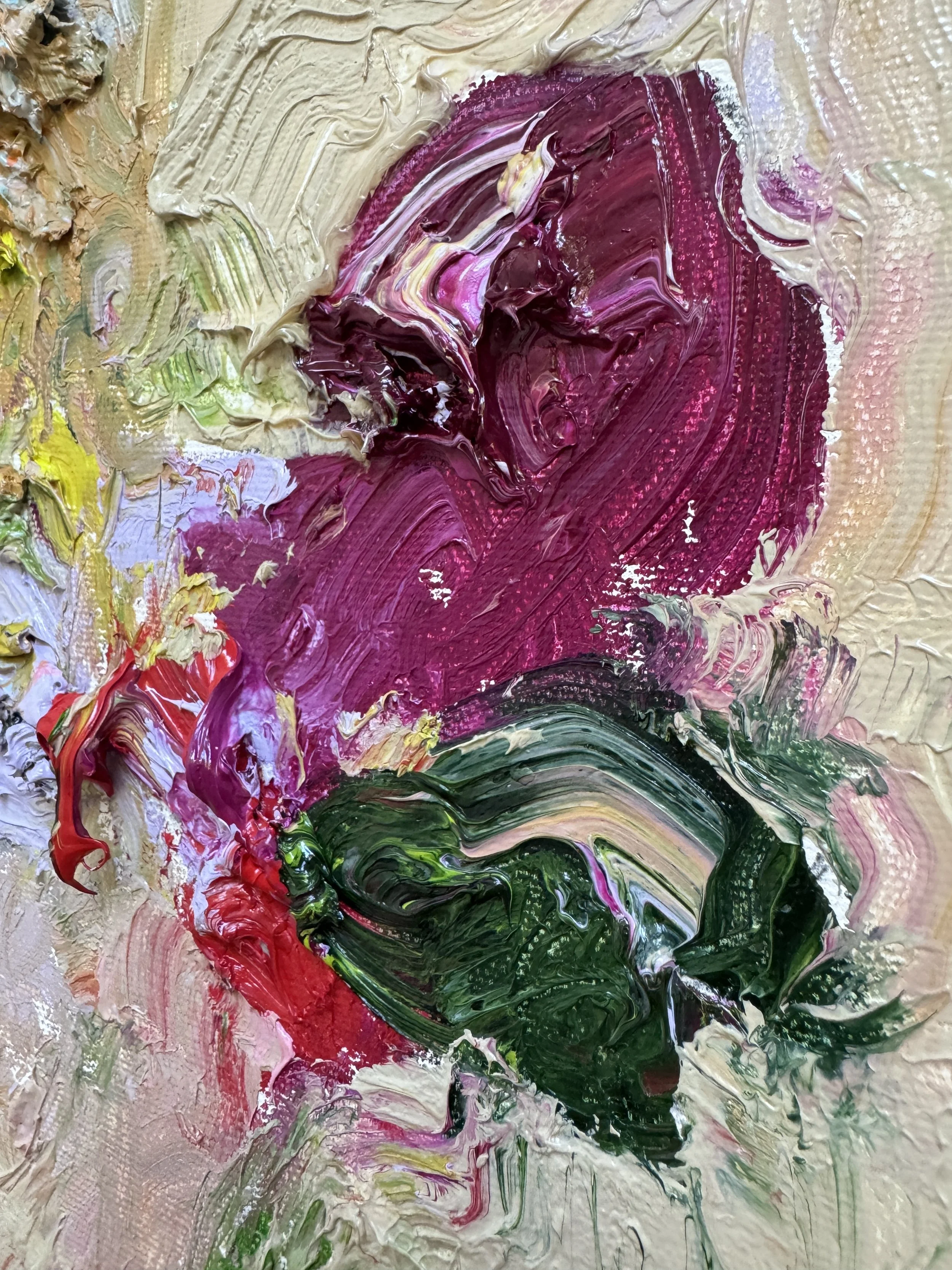 Close up of thick, textured magenta and green oil paint with expressive brushstrokes against a soft beige background.