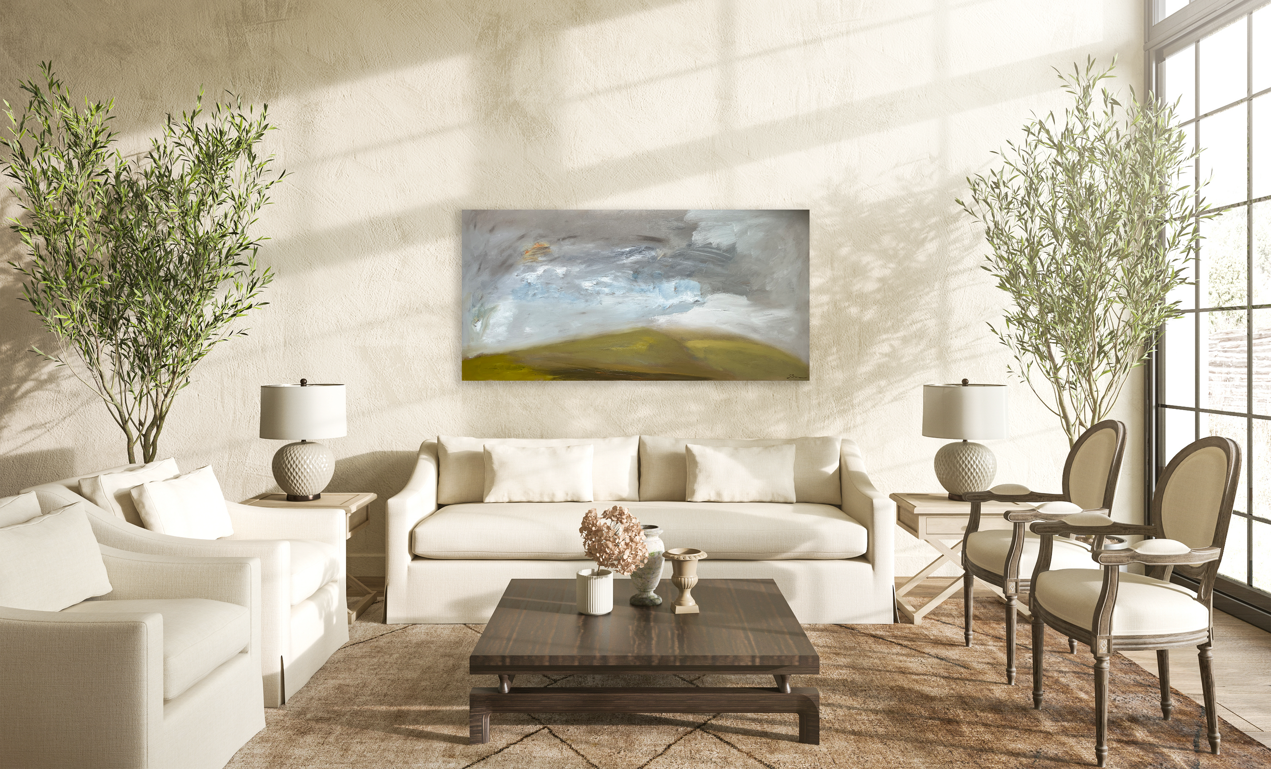 Large abstract landscape painting installed above a neutral living‑room sofa, styled with warm wood furniture, soft lighting, and potted greenery.