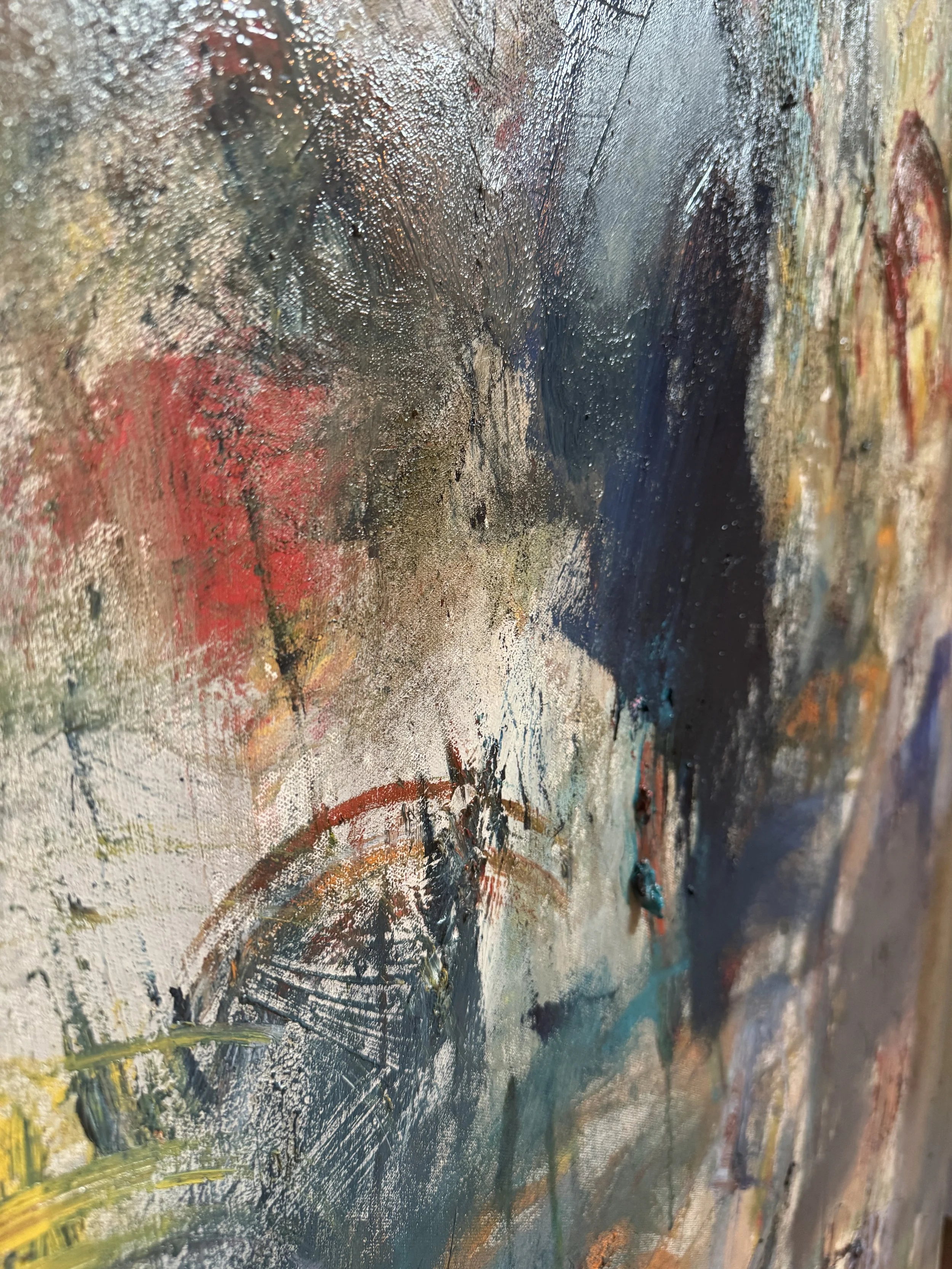 Vibrant abstract detail featuring bold blue, red, white, and yellow brushstrokes with dynamic texture.