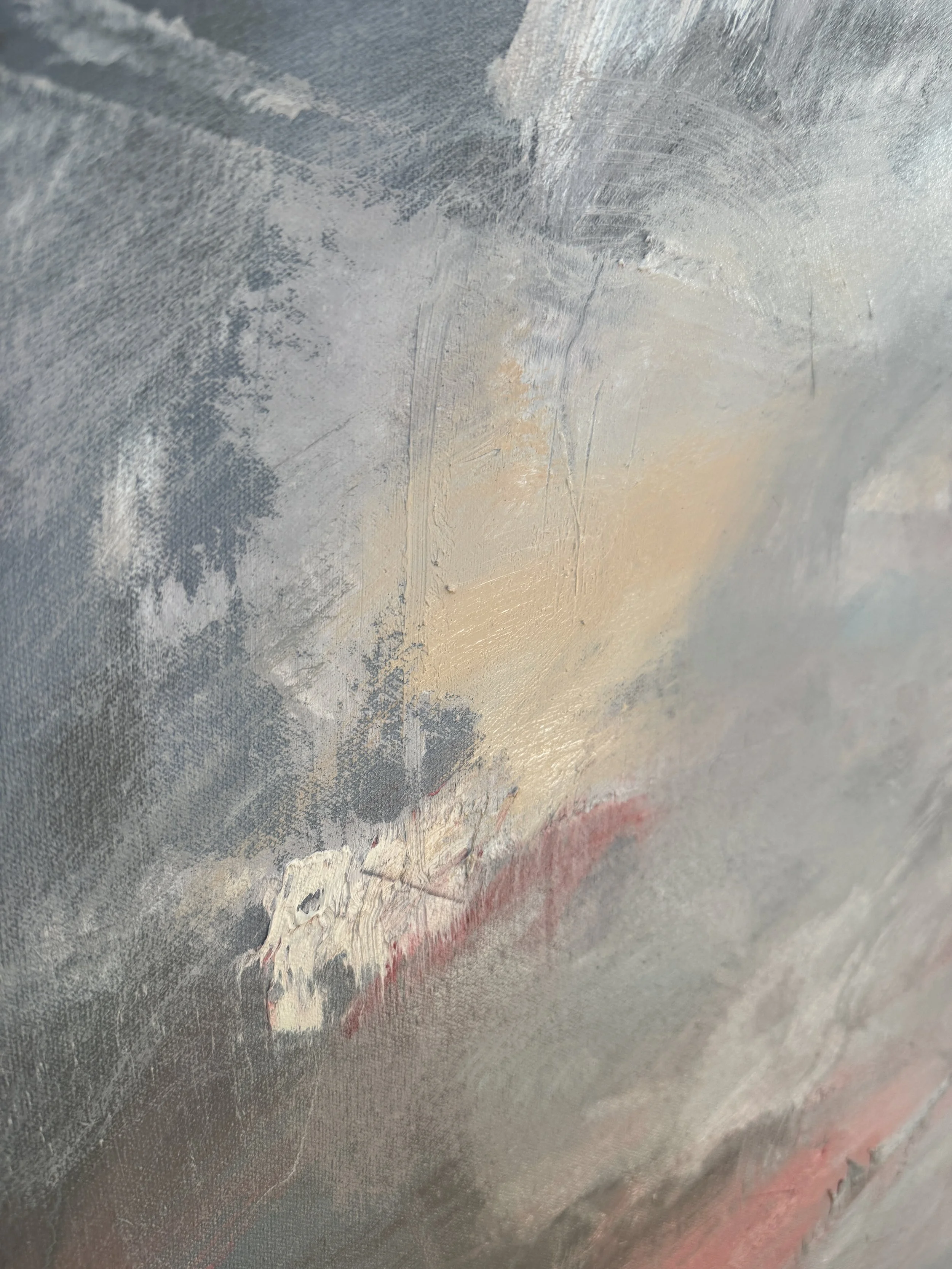 Close-up of abstract canvas with muted grays, beige, and red; thick, expressive brushwork adds texture and emotion.