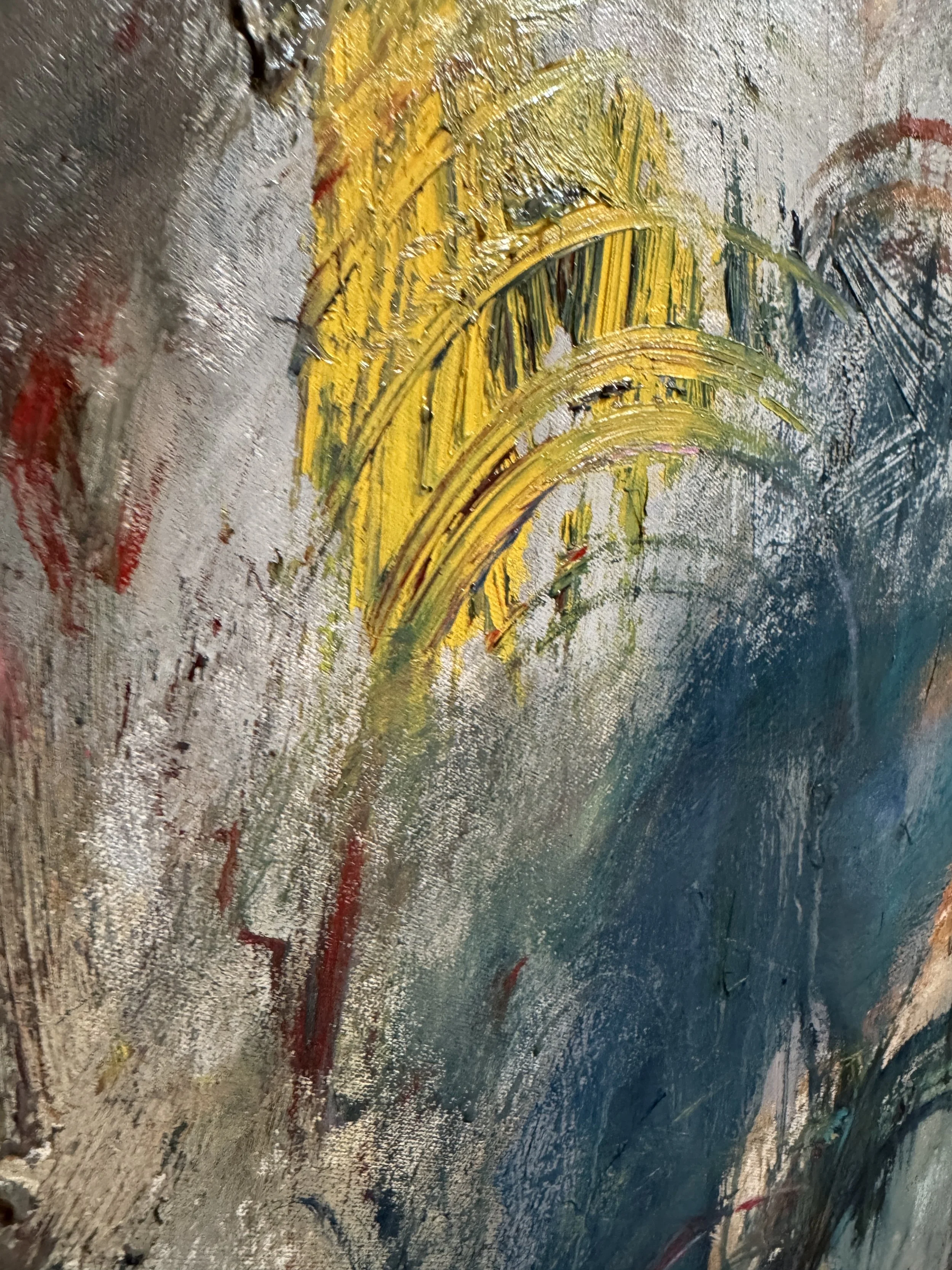 Textured abstract close‑up with layered strokes of red, yellow, white, and blue creating rich movement.