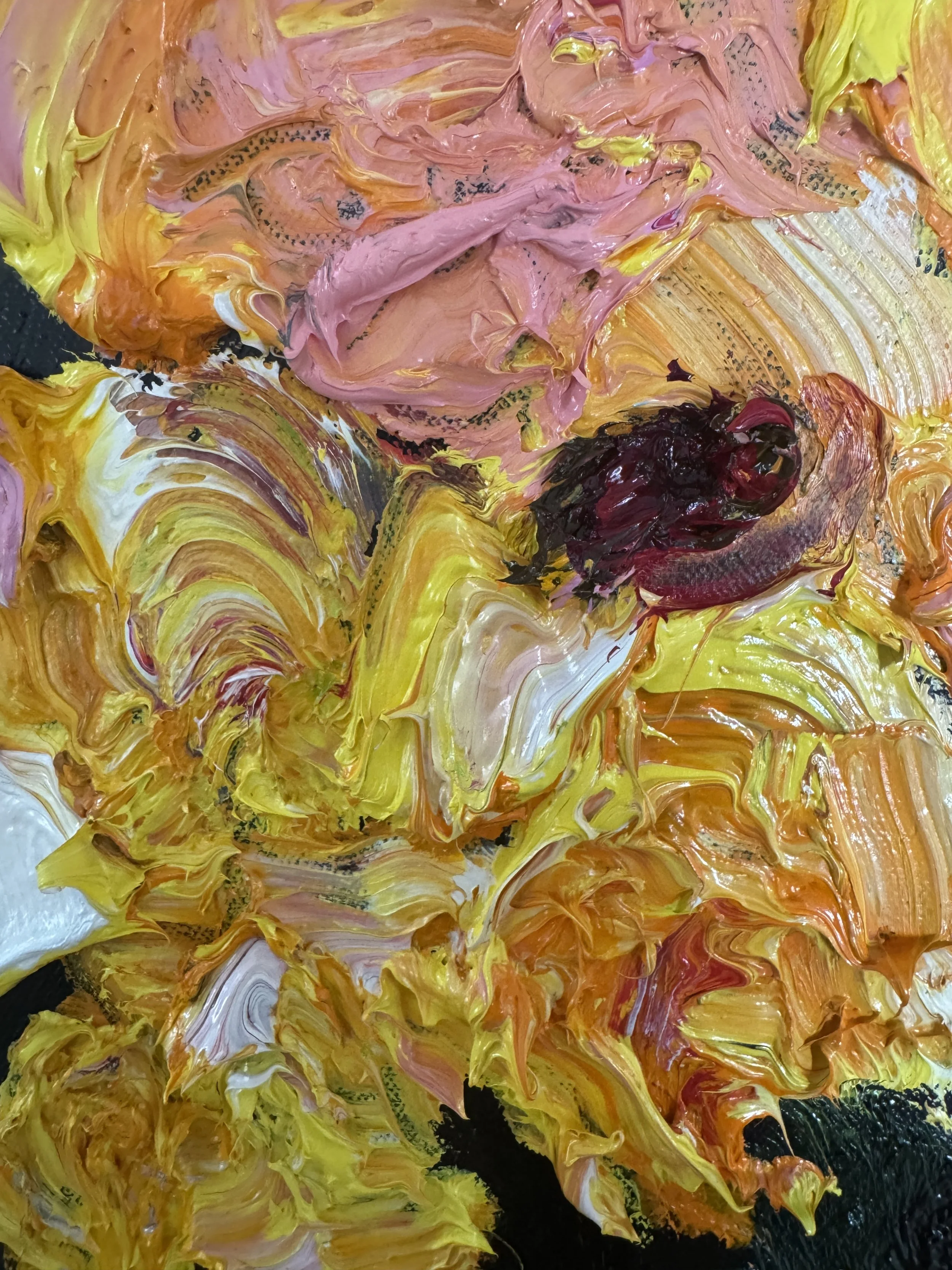 Abstract close‑up of heavy oil paint in yellow, orange, pink, white, and red tones.