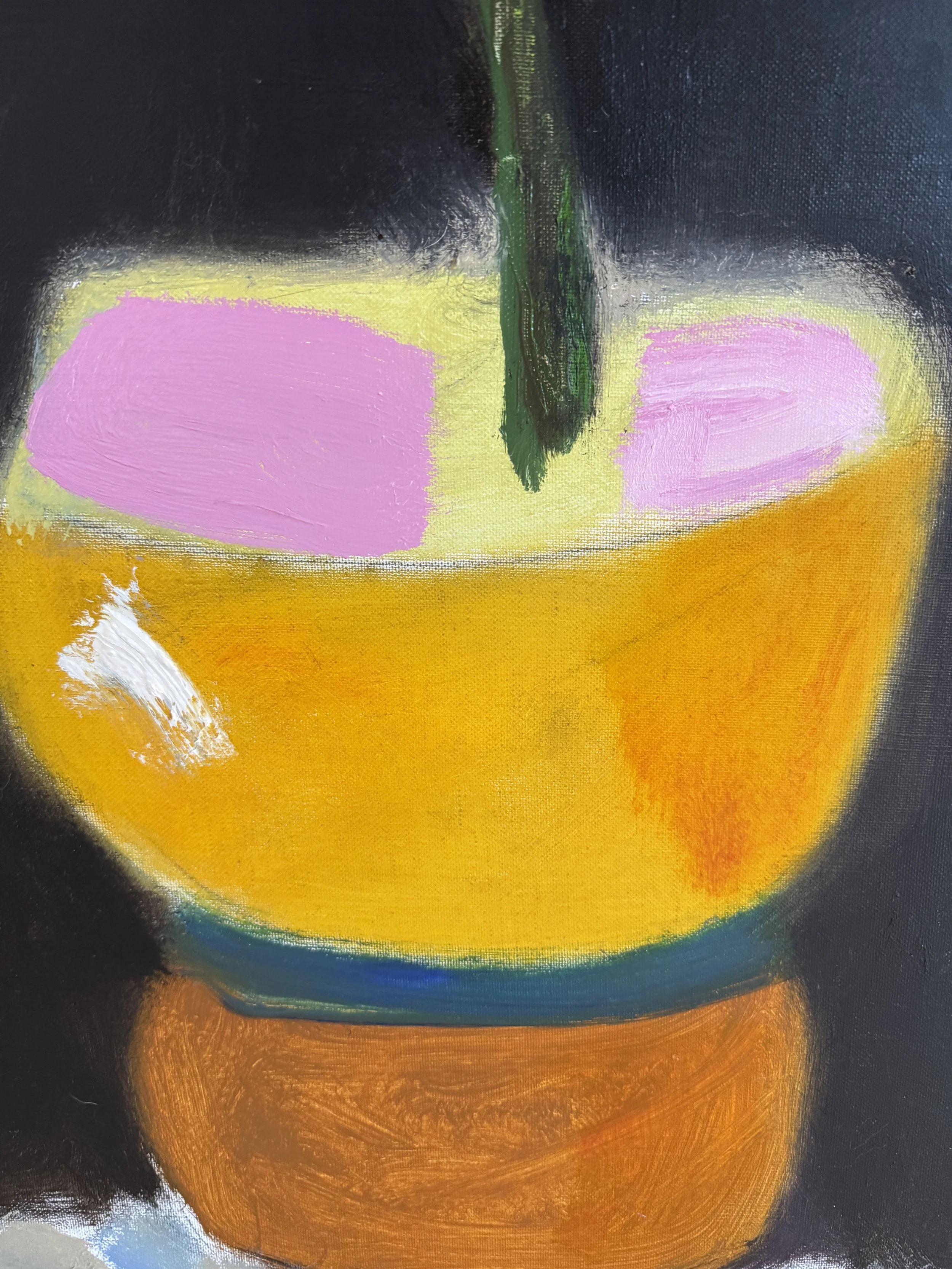 Vibrant abstract close‑up featuring bold yellow, pink, and orange forms with expressive brushstrokes on a dark backdrop.