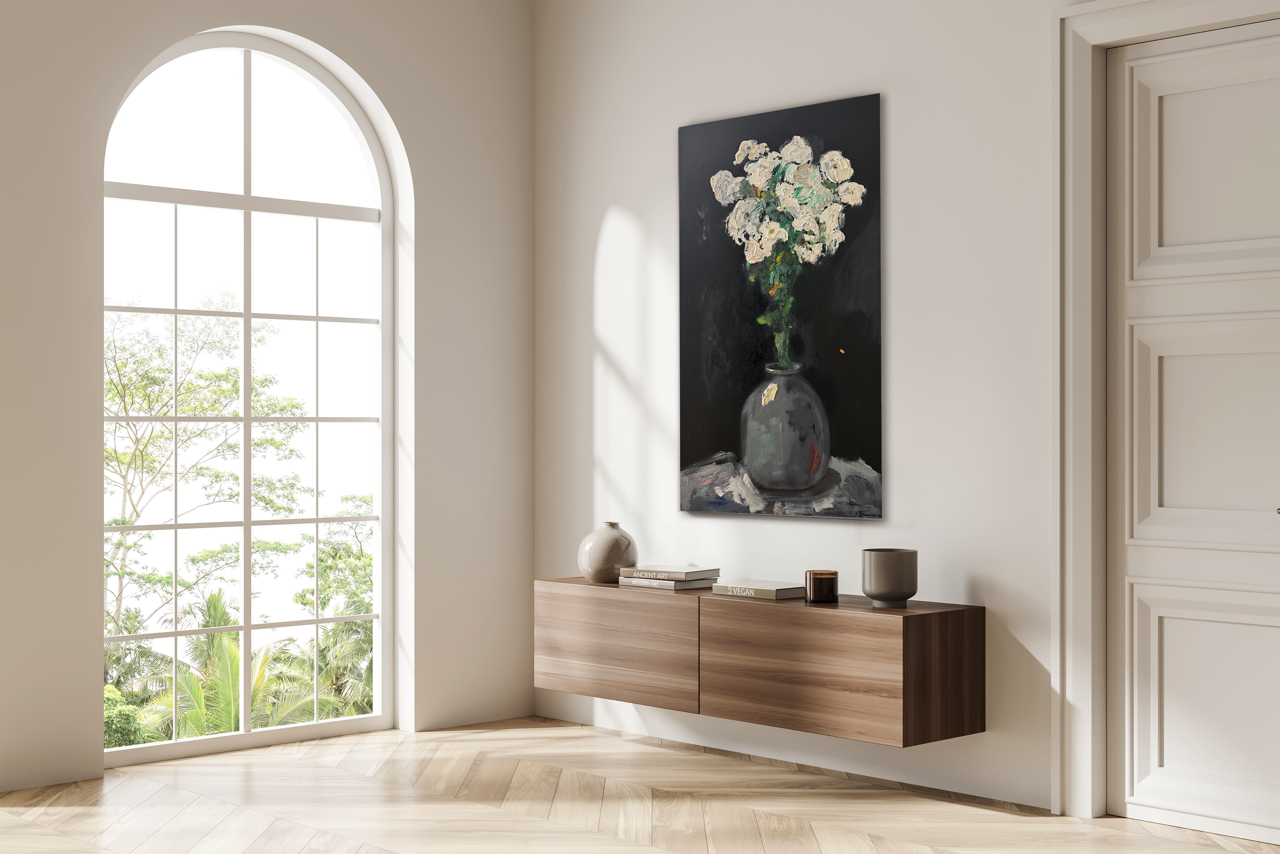 Minimalist room with an arched window, a floating wooden console, and a large floral painting hanging above it.