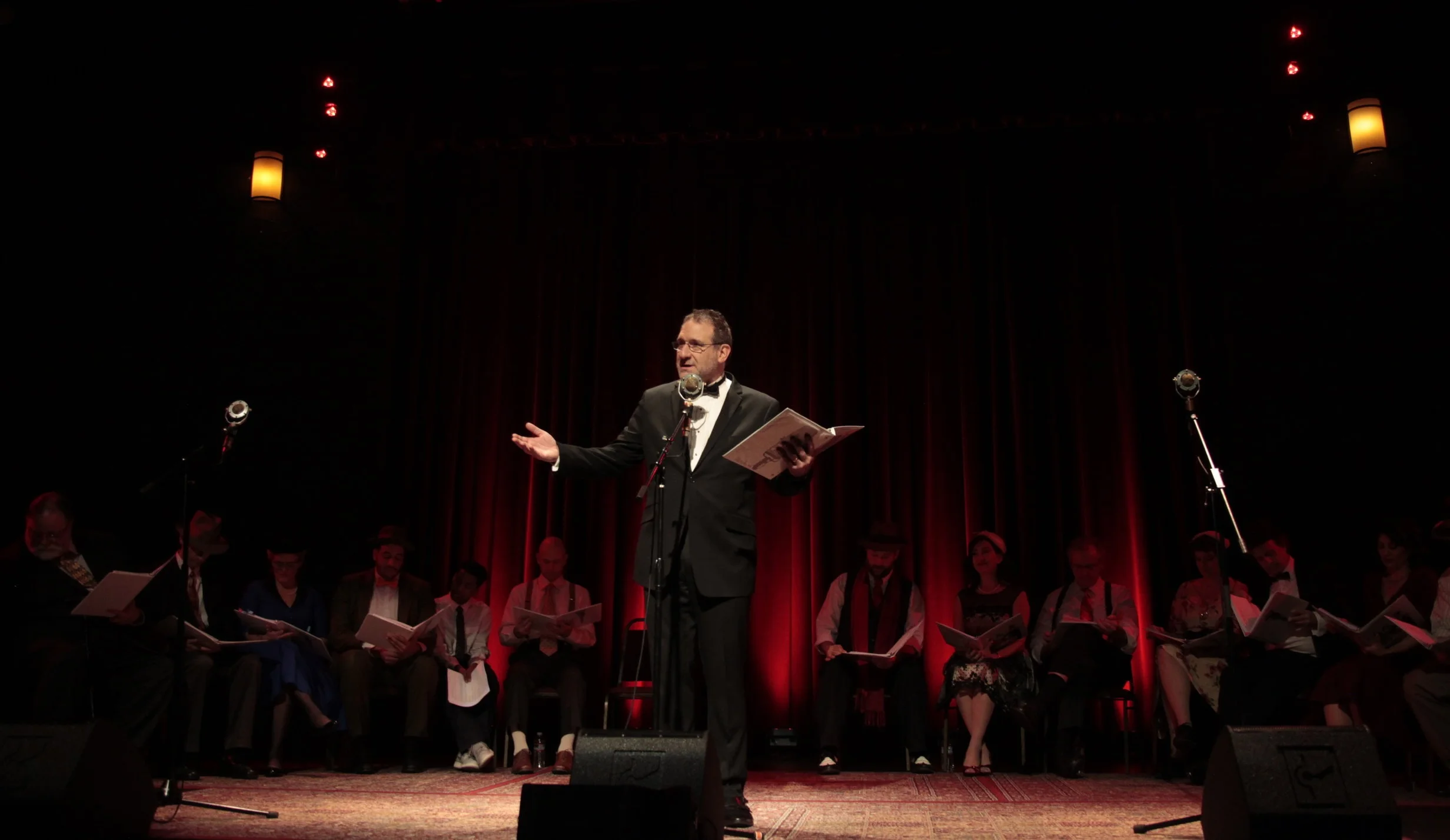 Fake Radio’s Artistic Director David Koff thanks the crowd during curtain call of Fake Radio's performance of "It's a Wonderful Life" at the Alberta Rose Theater