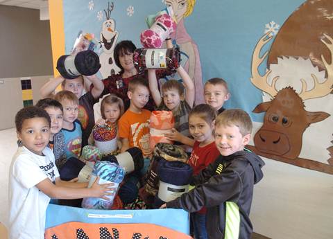 New blankets were recently donated to the ‘Blanket Buddies’ drop-off box at Higgins Elementary. Students in the Gifted and Talented program see daily the difference they are making as the box fills up with child blankets they will donate to the Children’s Advocacy Center. Project initiators from left are Quin Bills, David Pena, William Trenchard, Colston Fendley, Kelsey Jackson, GT instructor Sonja Carter, Dane Dillen, Jackson Jones, Brayden Hammer, Ansley Fisher, and Colt Fendley. Not shown is Gavin Lassiter.