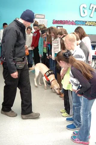 To demonstrate the keen sense of smell of an arson dog, Bailey 5 th grade GT students lined up to see if Sadie could detect the shoe that had an accelerant on them.