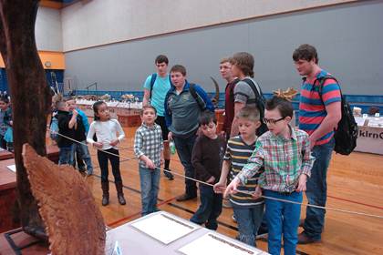 Students of all ages toured the “Dinosaur George” exhibit. North Lamar High School science students who meandered through the showing are Dakota Grissom, Anthony Rizzo, Maverick Priest, Sam Asay and Christian Miears. Studying the larger fossils alongside the upper classmen, from left, are Everett 2 nd graders Parker Scott, Cade Thoms, Joanna Ramirez, Laramy Smith, Seth LaRue, Blake Hoover, and Caleb Echols.
