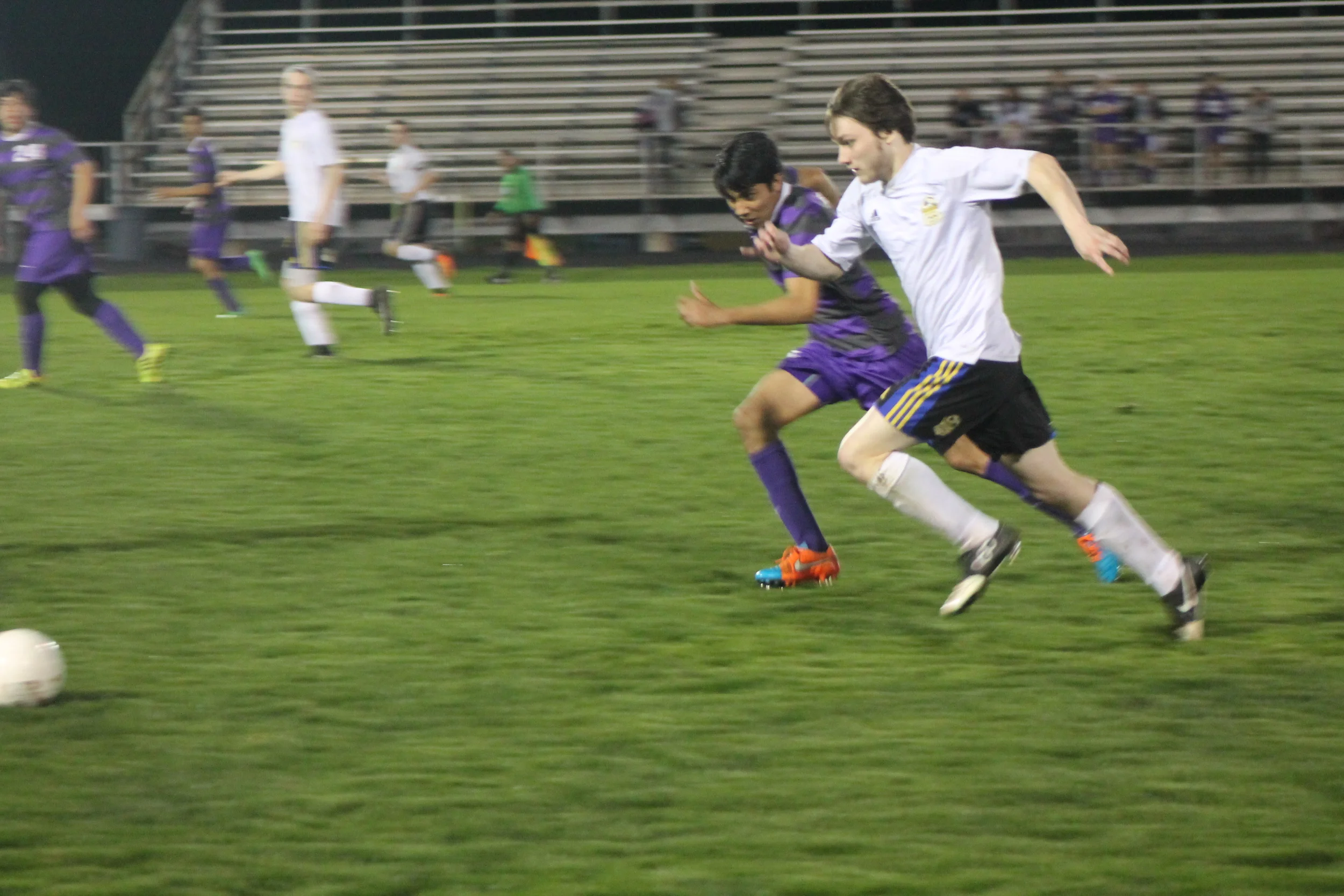 (Photo by Jared Routon) Chance Kent runs down the ball against Bonham