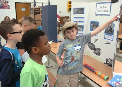 Rhett Bestul comfortably talked about what he had learned about The Great Barrier Reef in Australia to Caleb Echols (left) and J. T. Franklin (center).