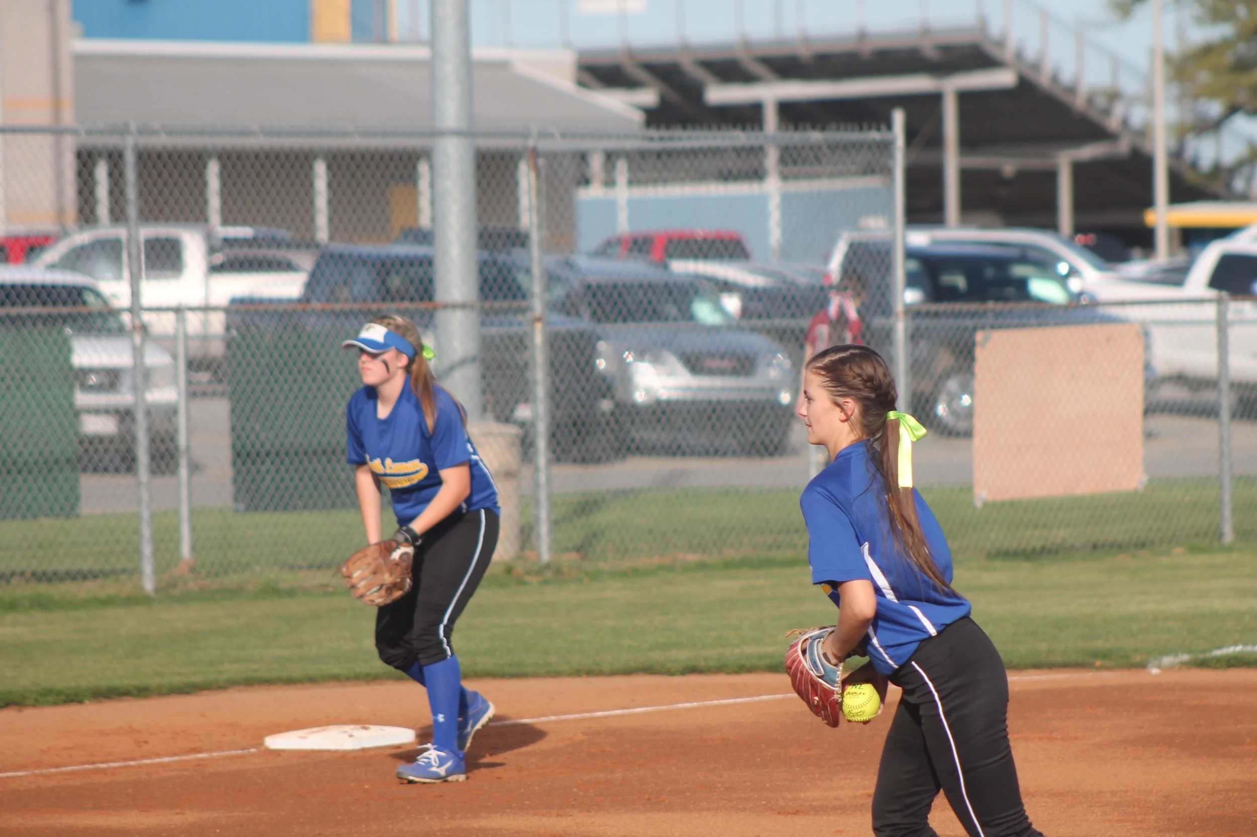 Reagan Richardson getting set to pitch as Erin Scholl watches earlier in the year.